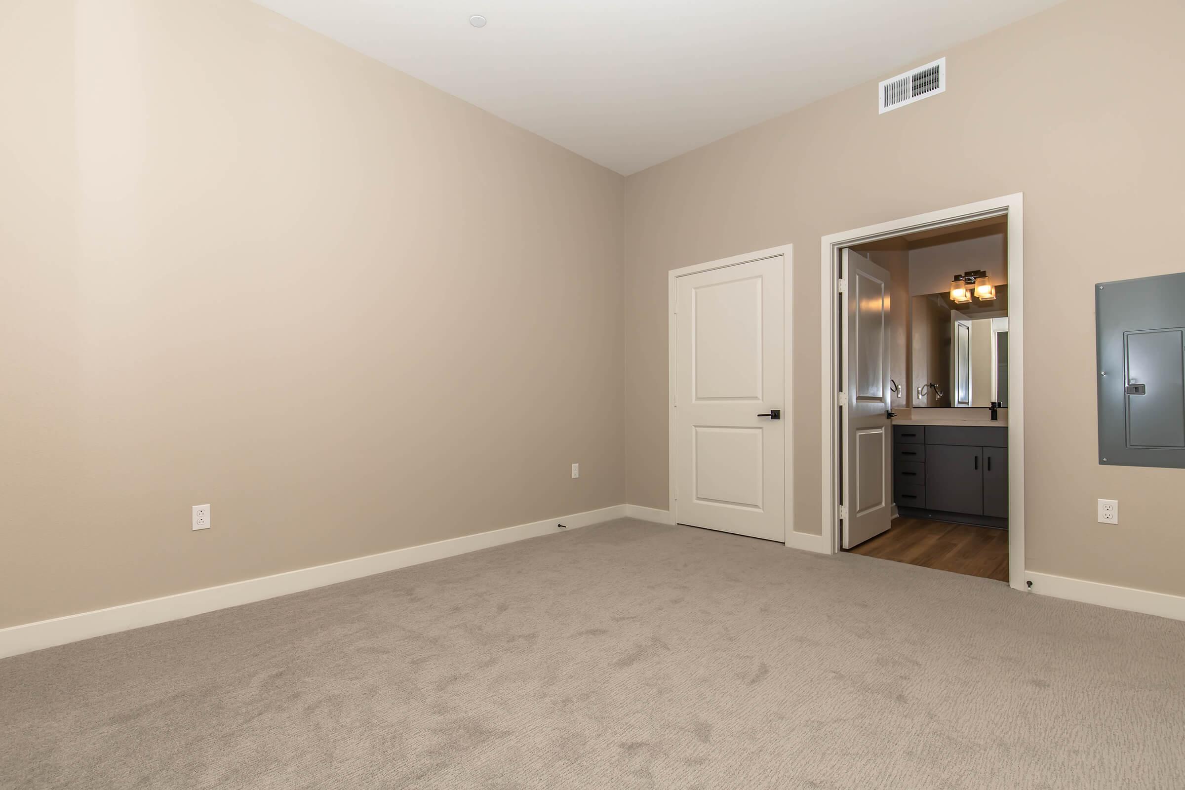 a bedroom with a large mirror