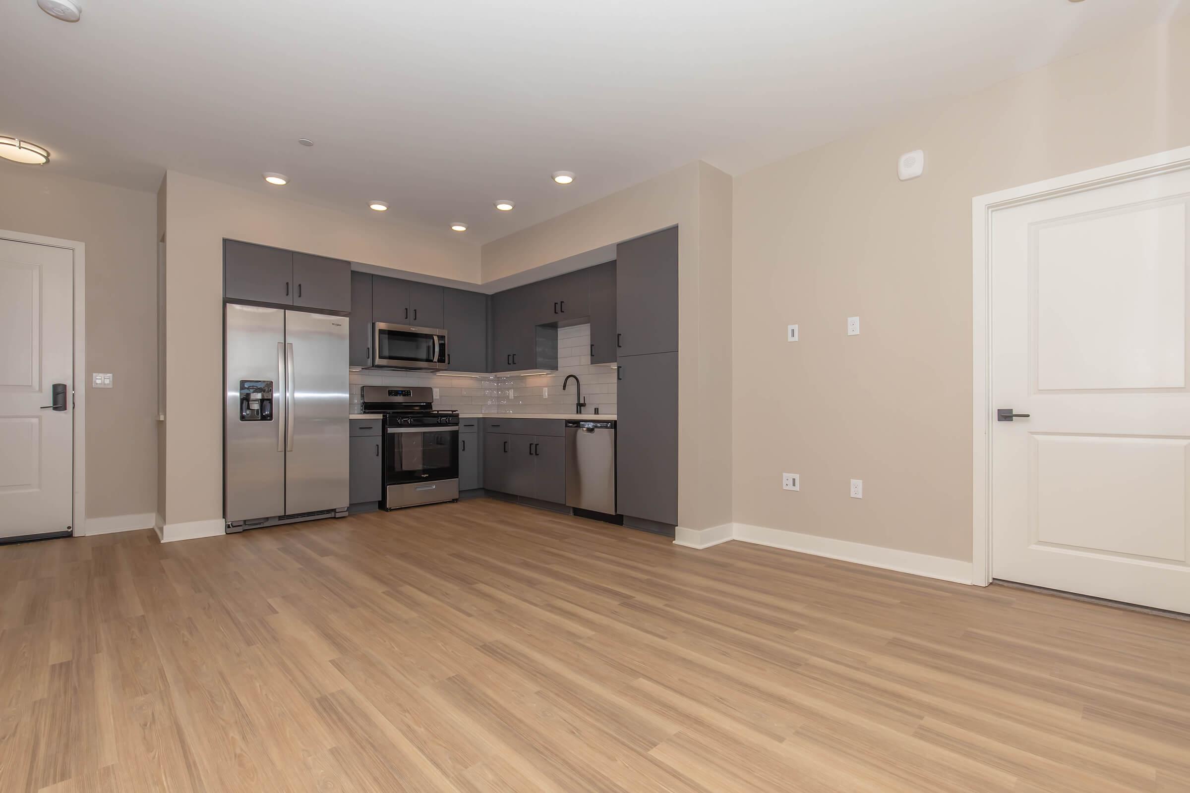 a kitchen with a wood floor