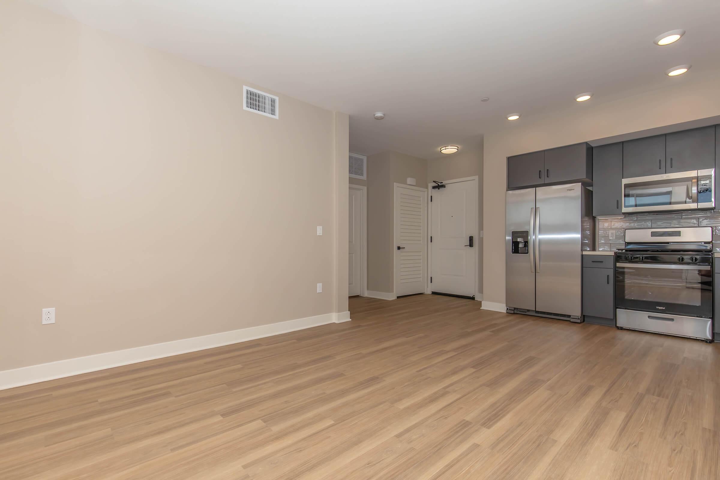 a kitchen with a wood floor