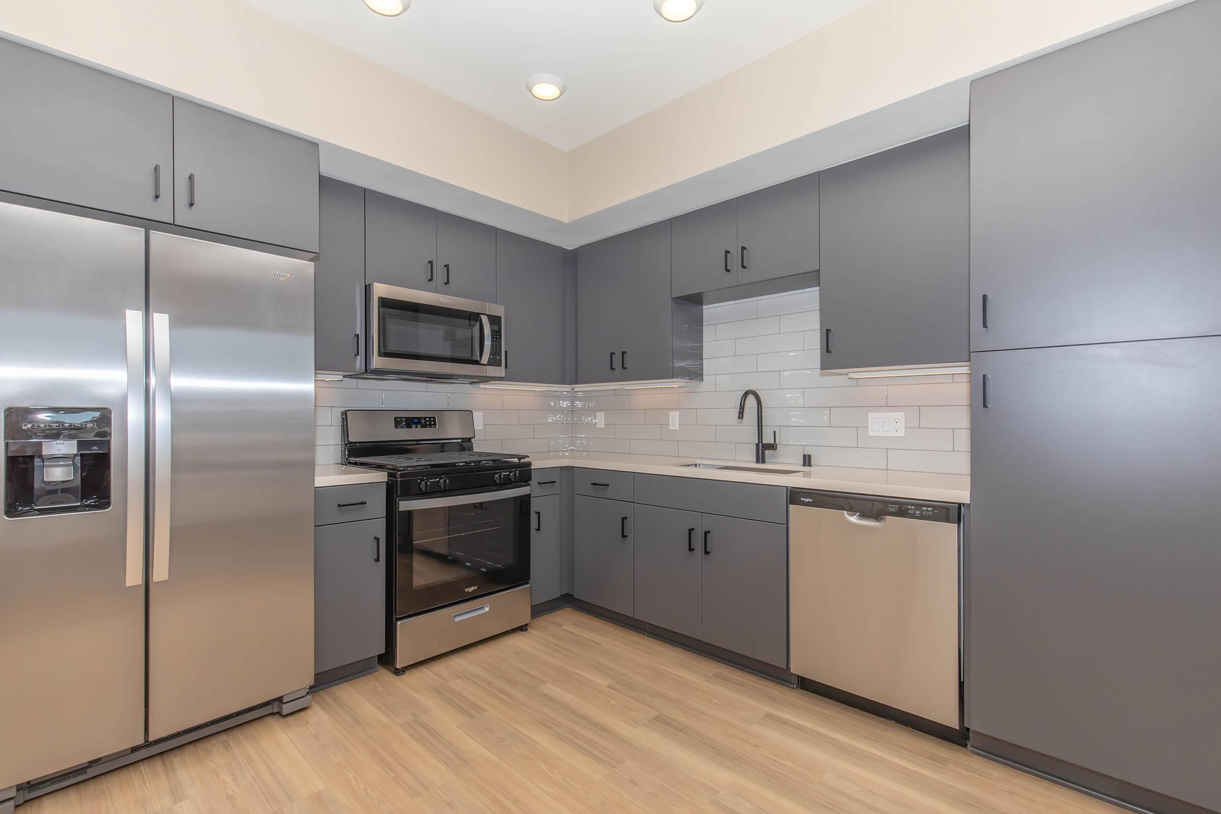 a large kitchen with stainless steel appliances