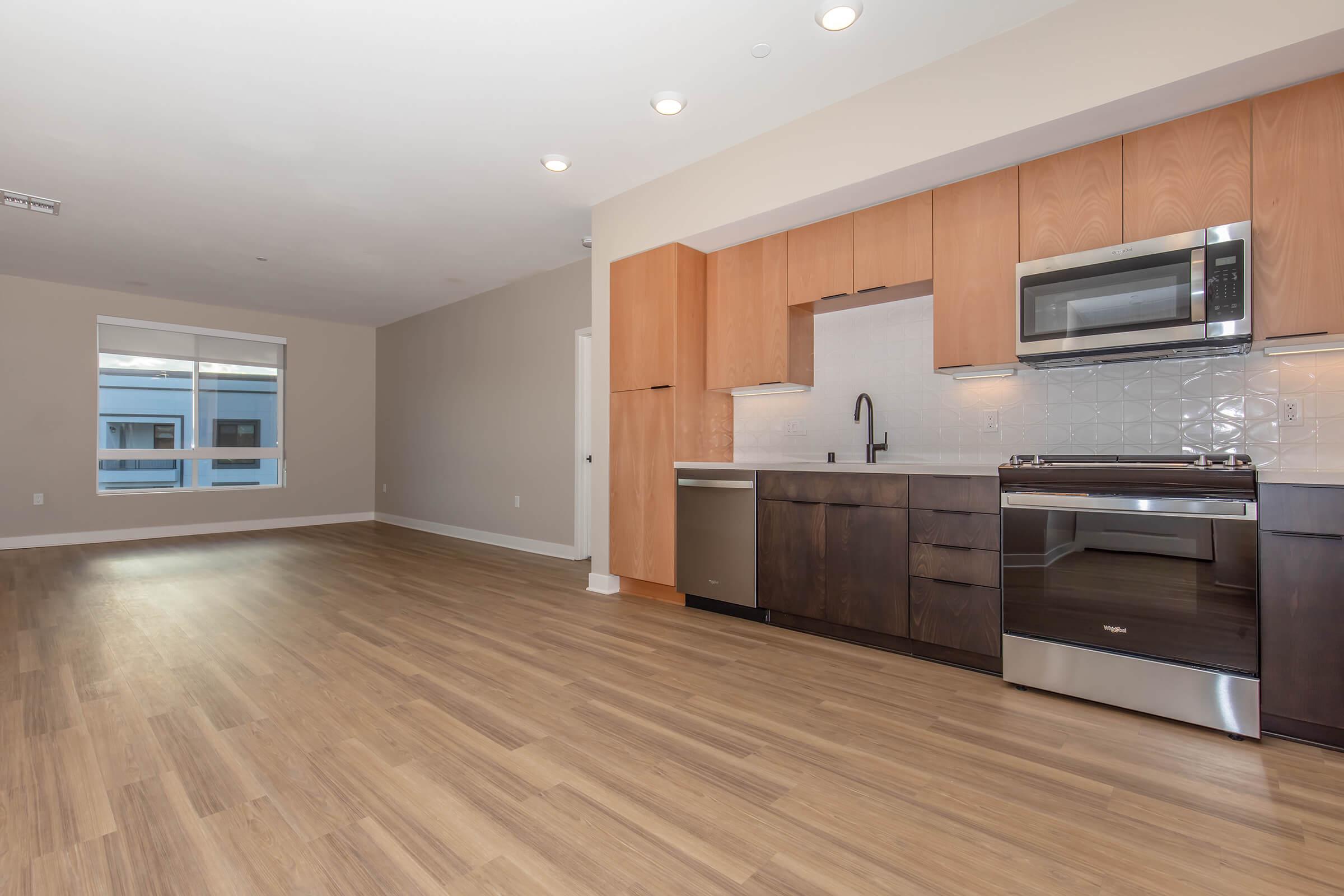 a kitchen with a wood floor