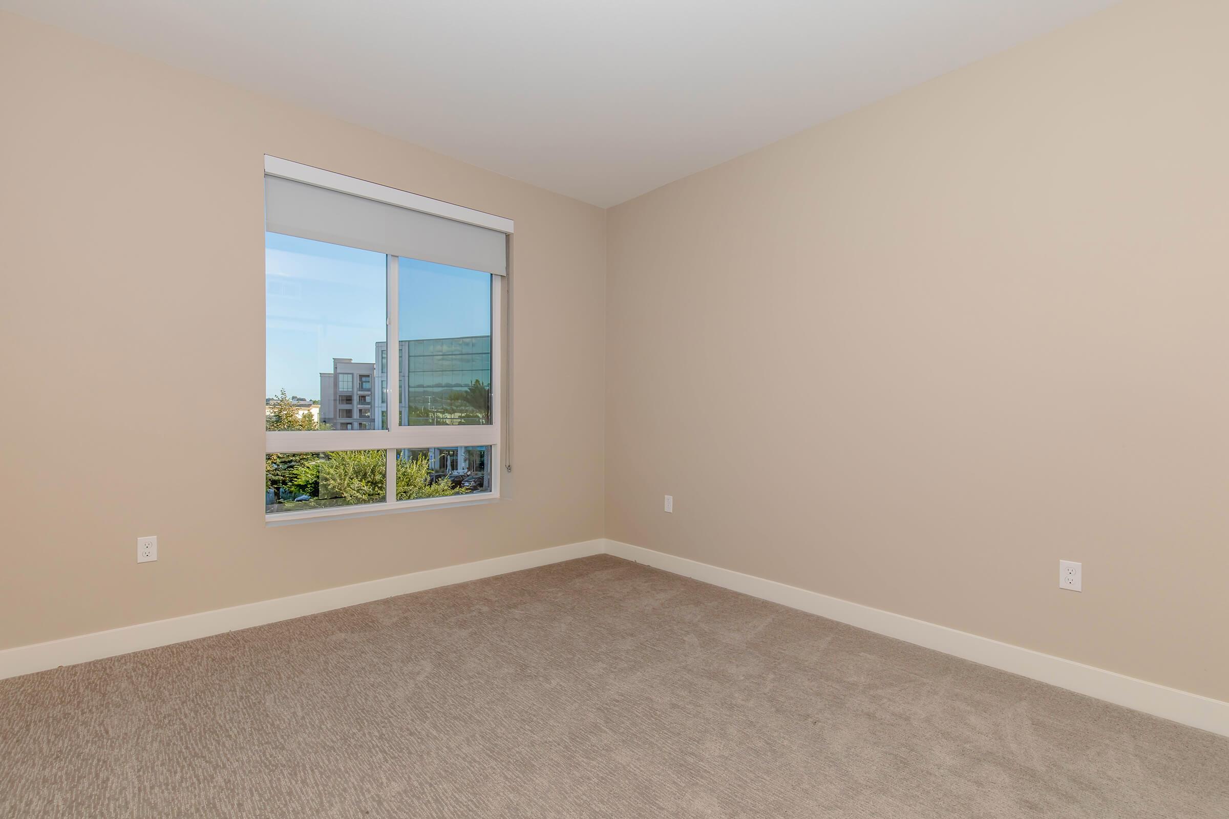 a bedroom with a large window