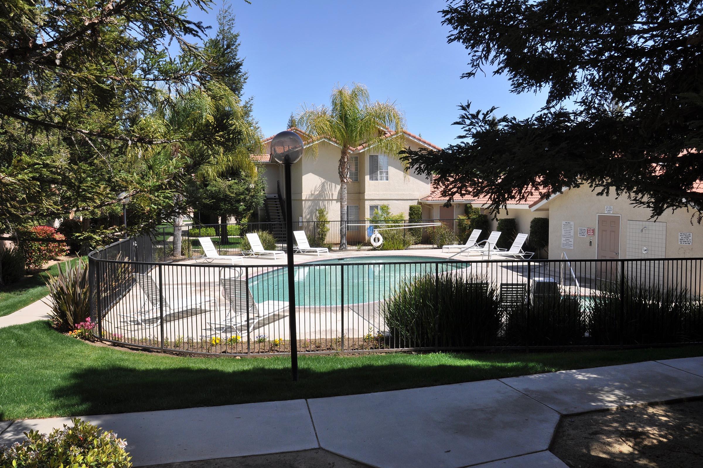 a house with a fence in a park