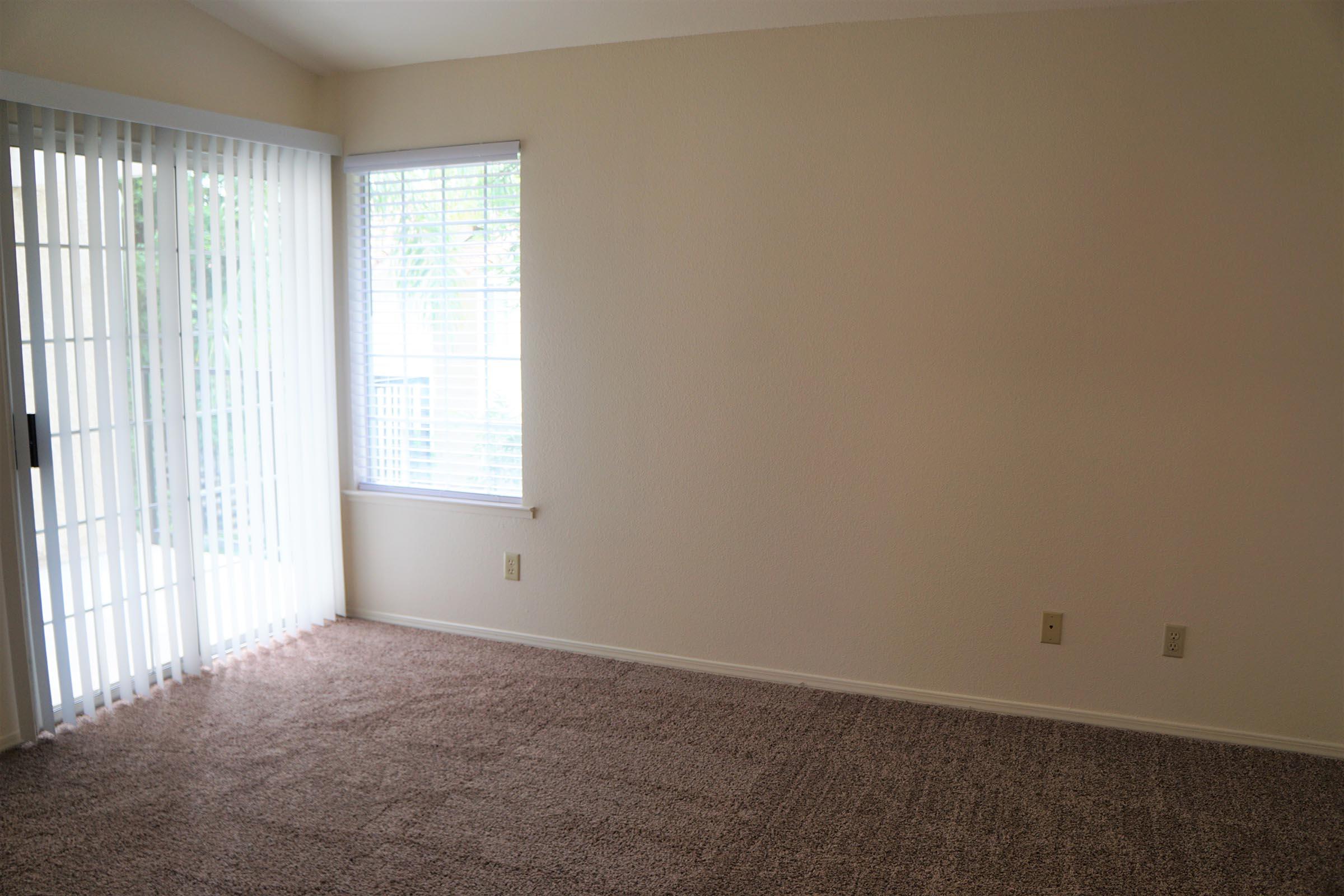 a bedroom with a large window