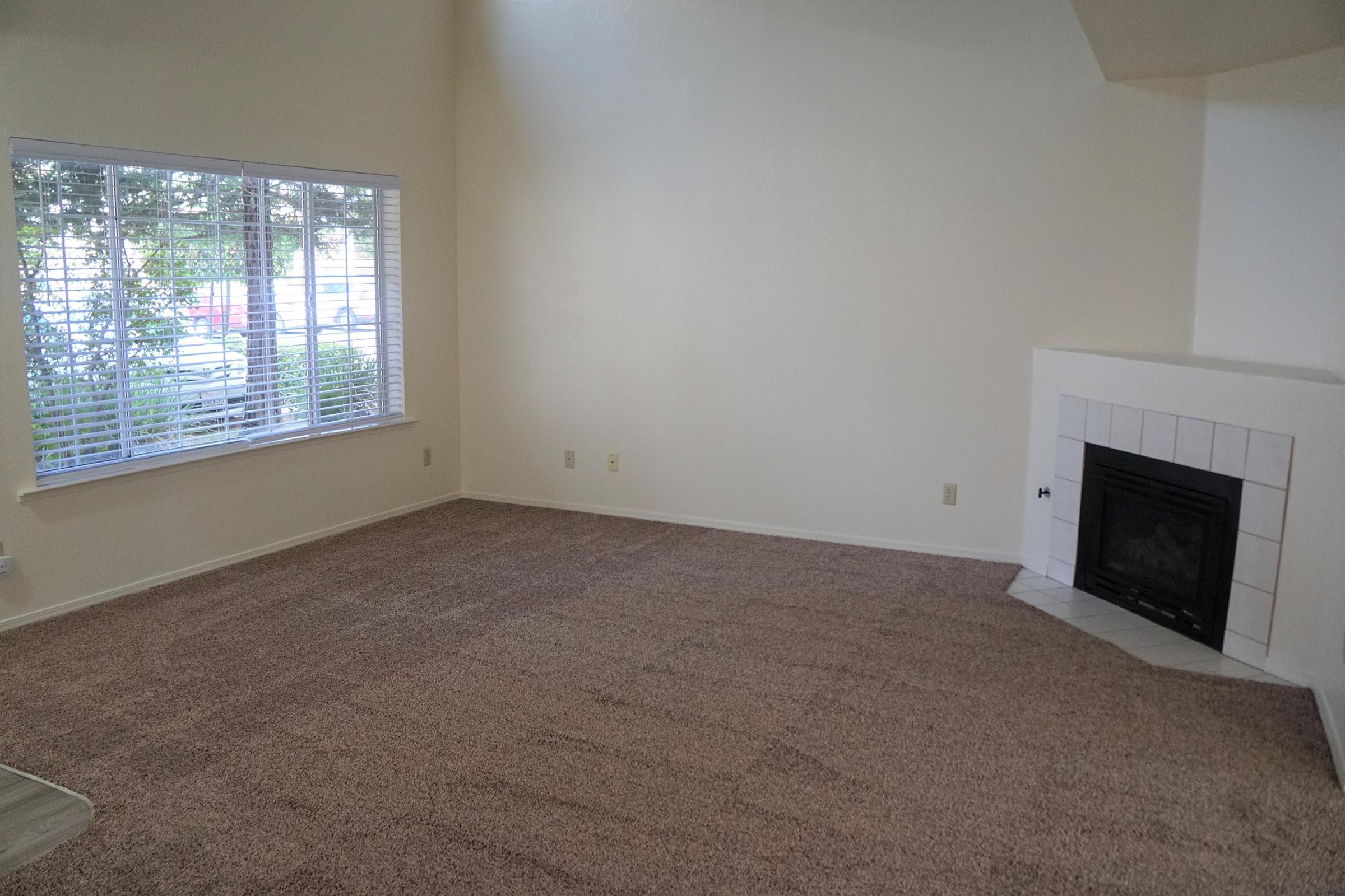 a living room next to a window