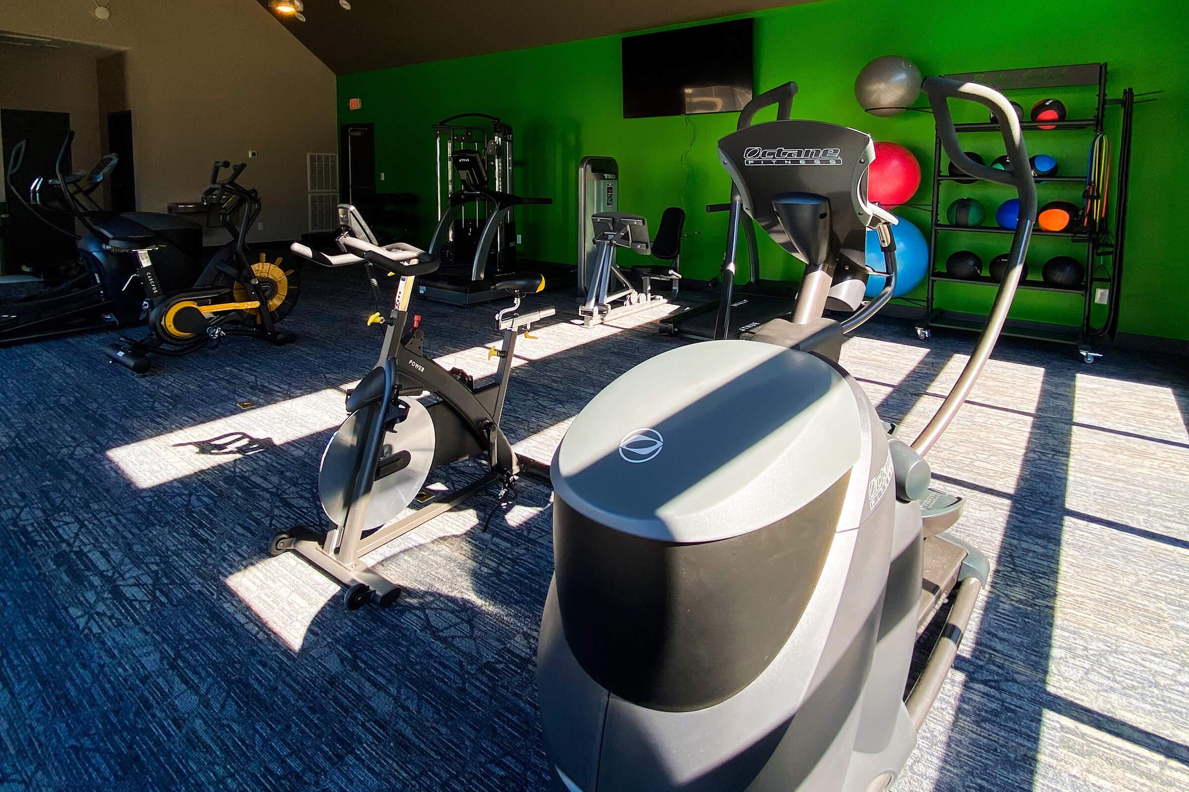 A gym with exercise equipment