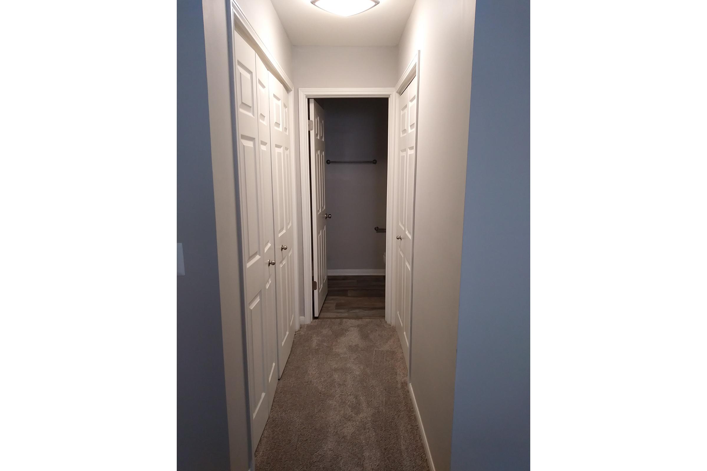 11) Gray Rehab Master Closet Hallway-2.jpg