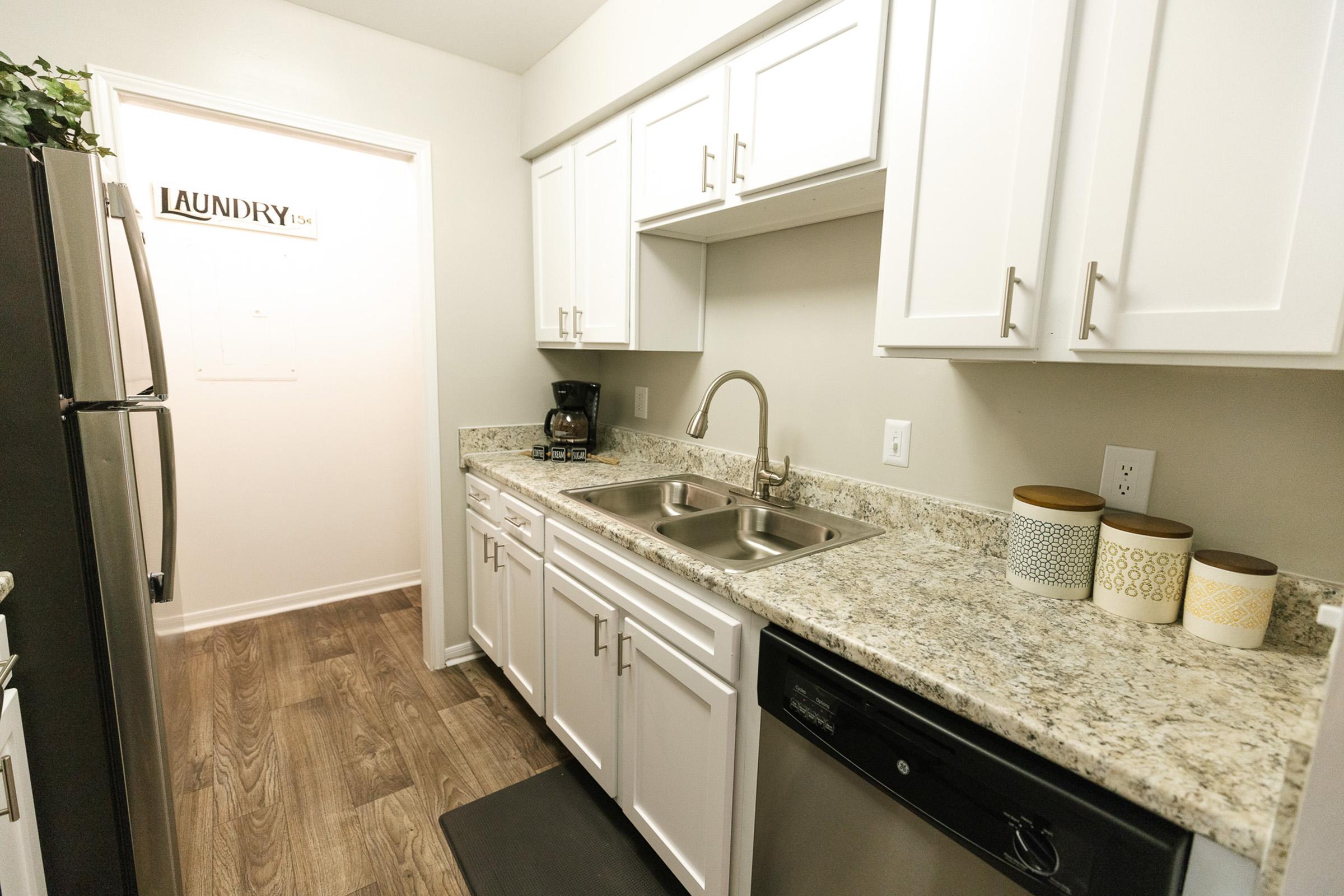 a kitchen with a sink and a microwave