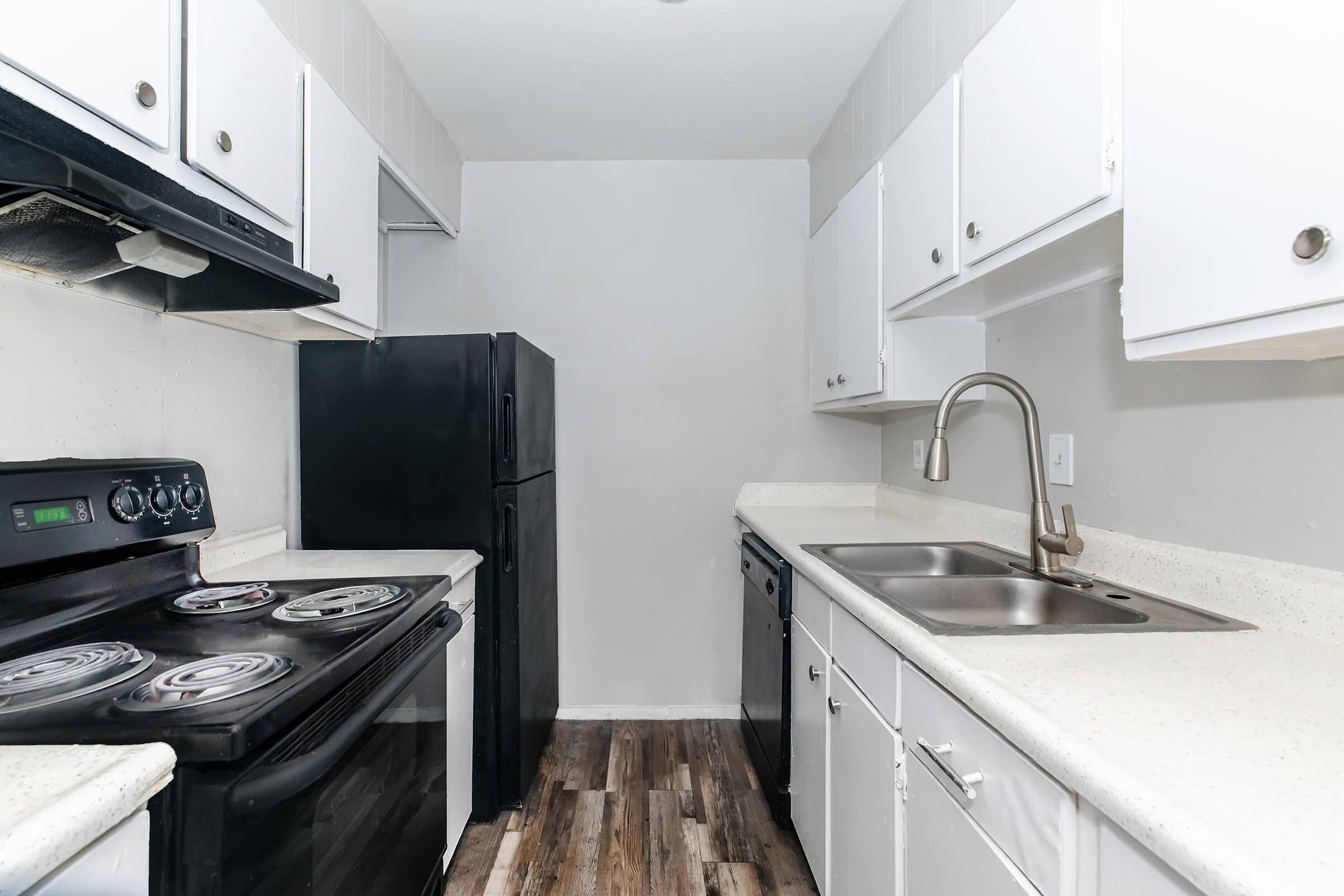 a kitchen with a stove top oven