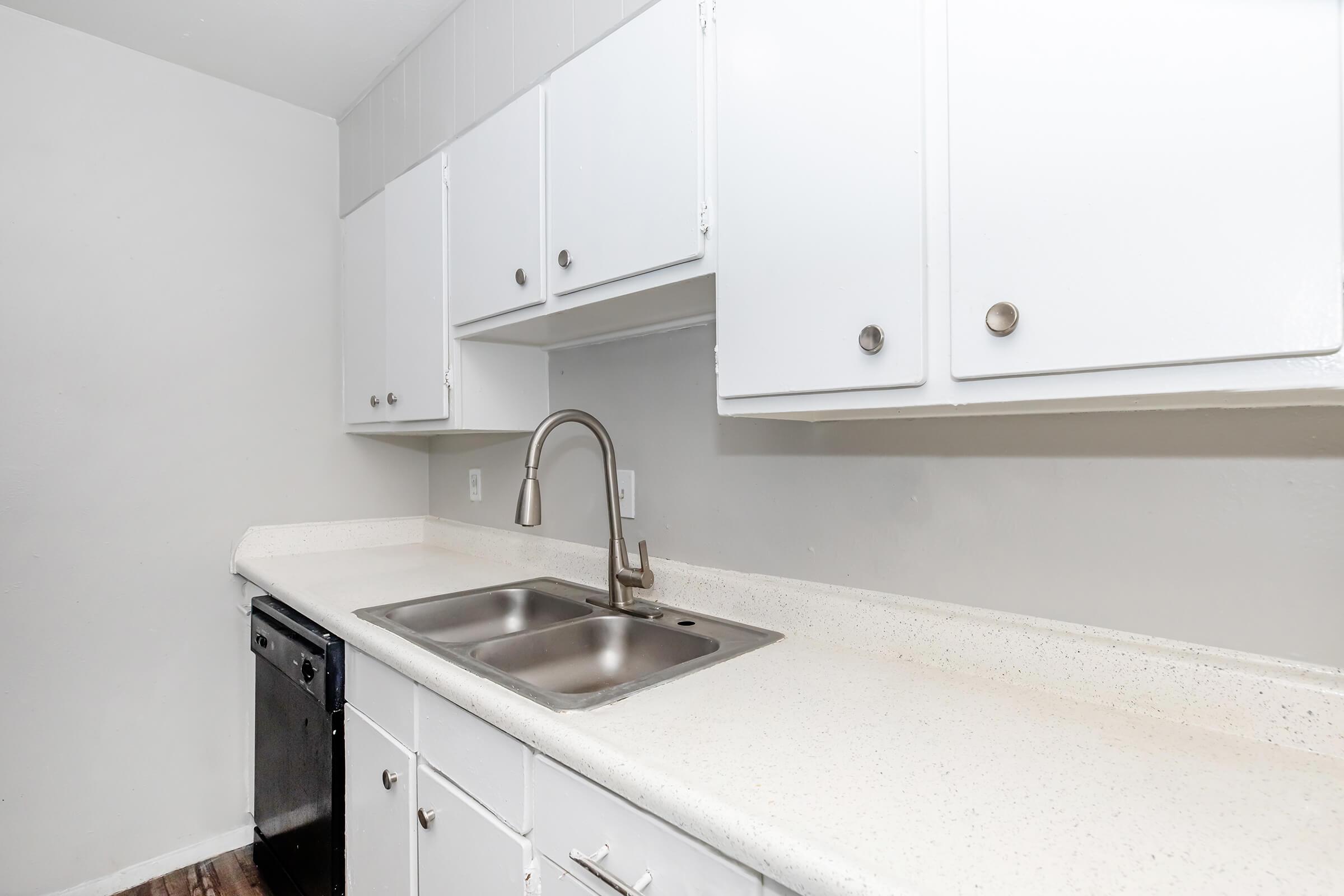 a kitchen with a stove and a sink