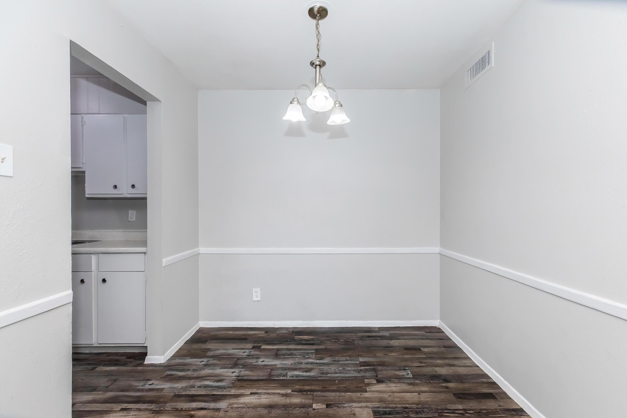 a kitchen with a sink and a refrigerator