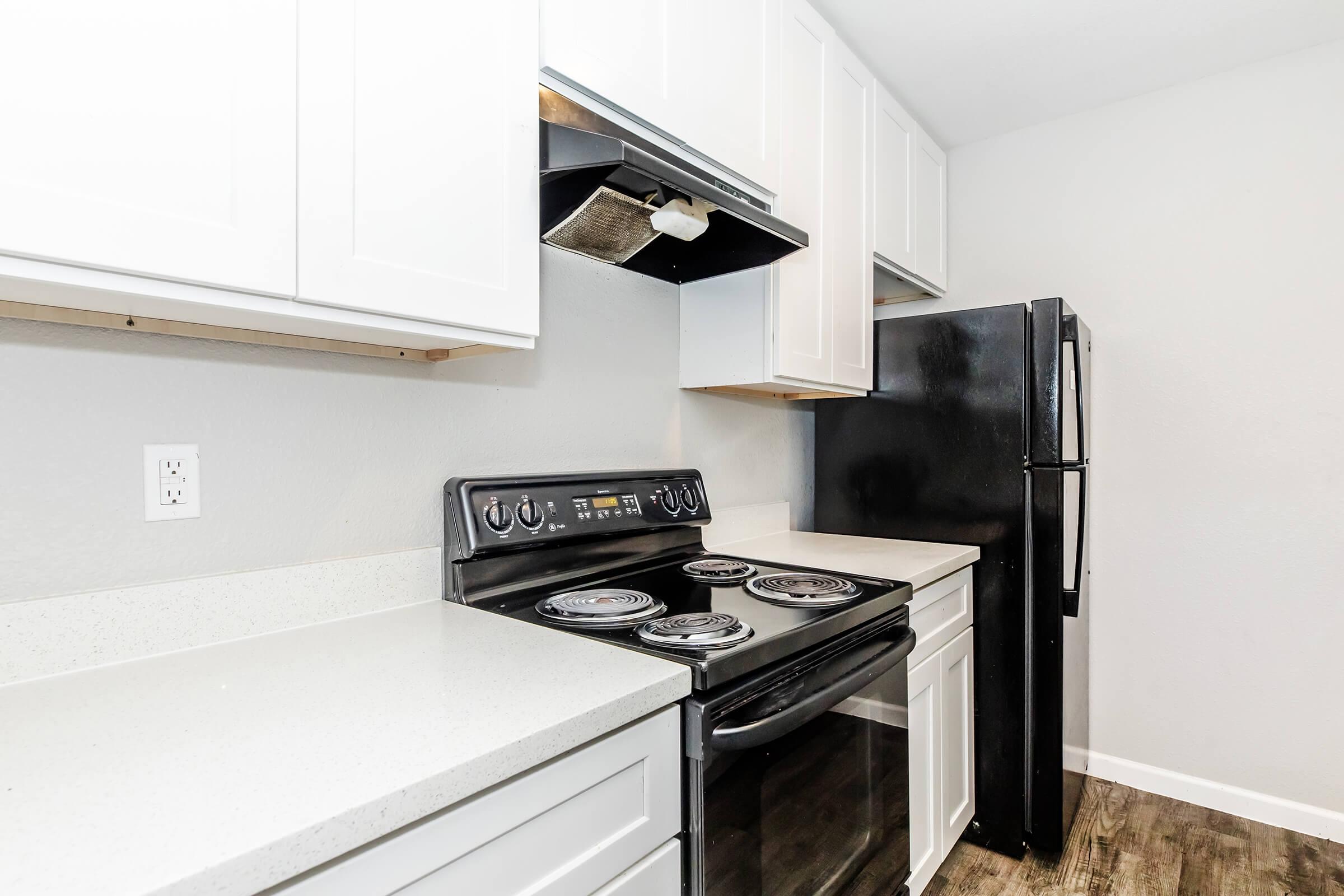 a kitchen with a stove top oven