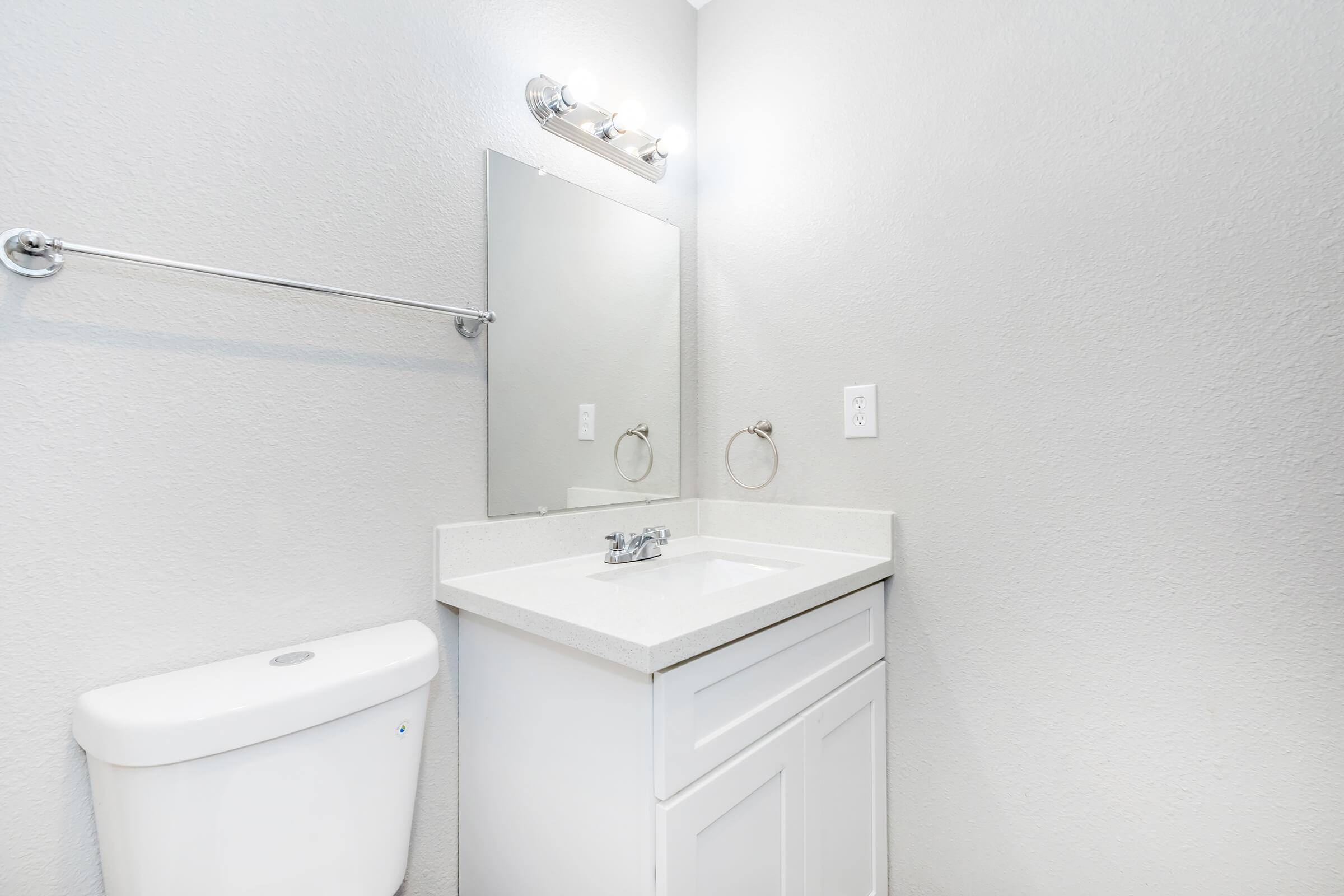 a close up of a sink and a mirror