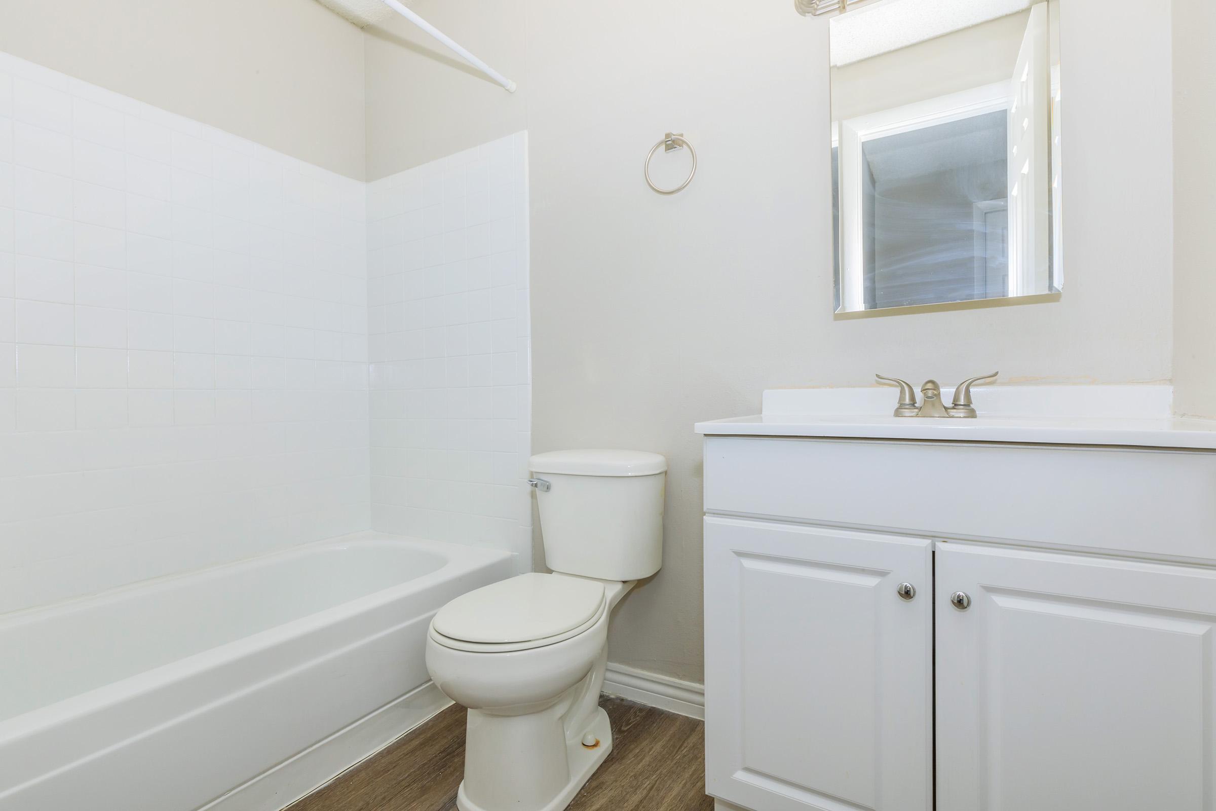 a sink sitting under a window