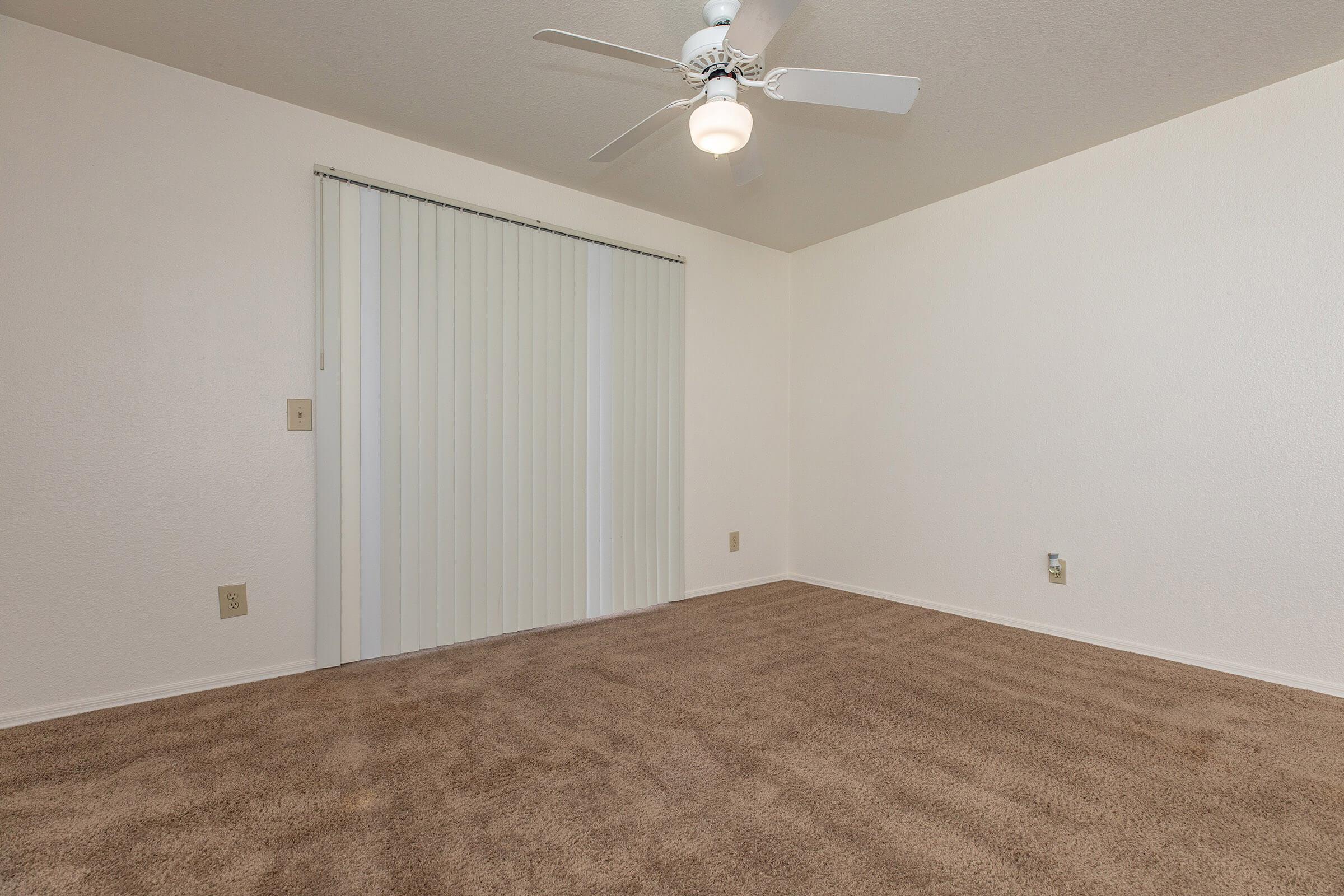 a bedroom with a bed and a mirror