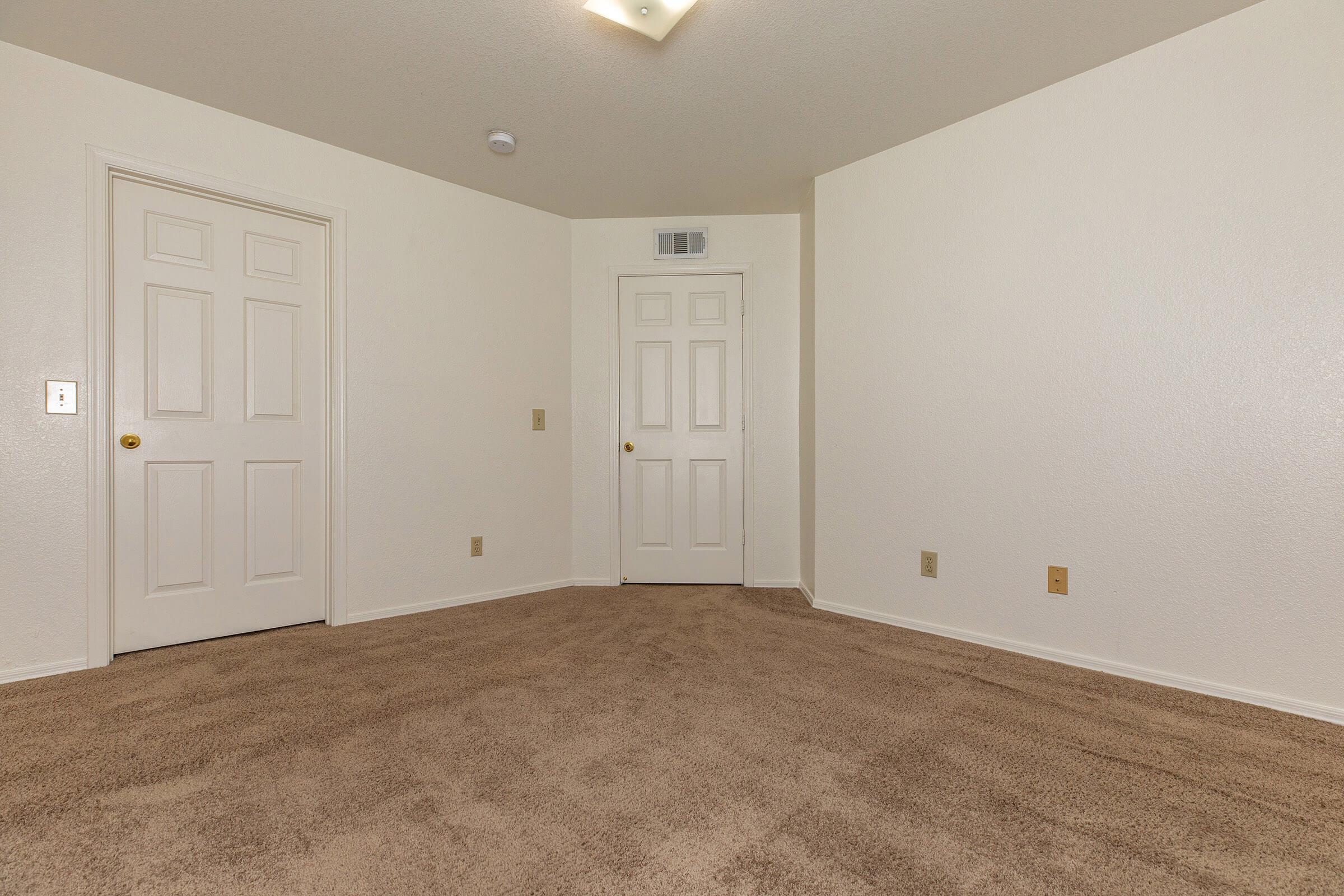 a bedroom with a bed in a room
