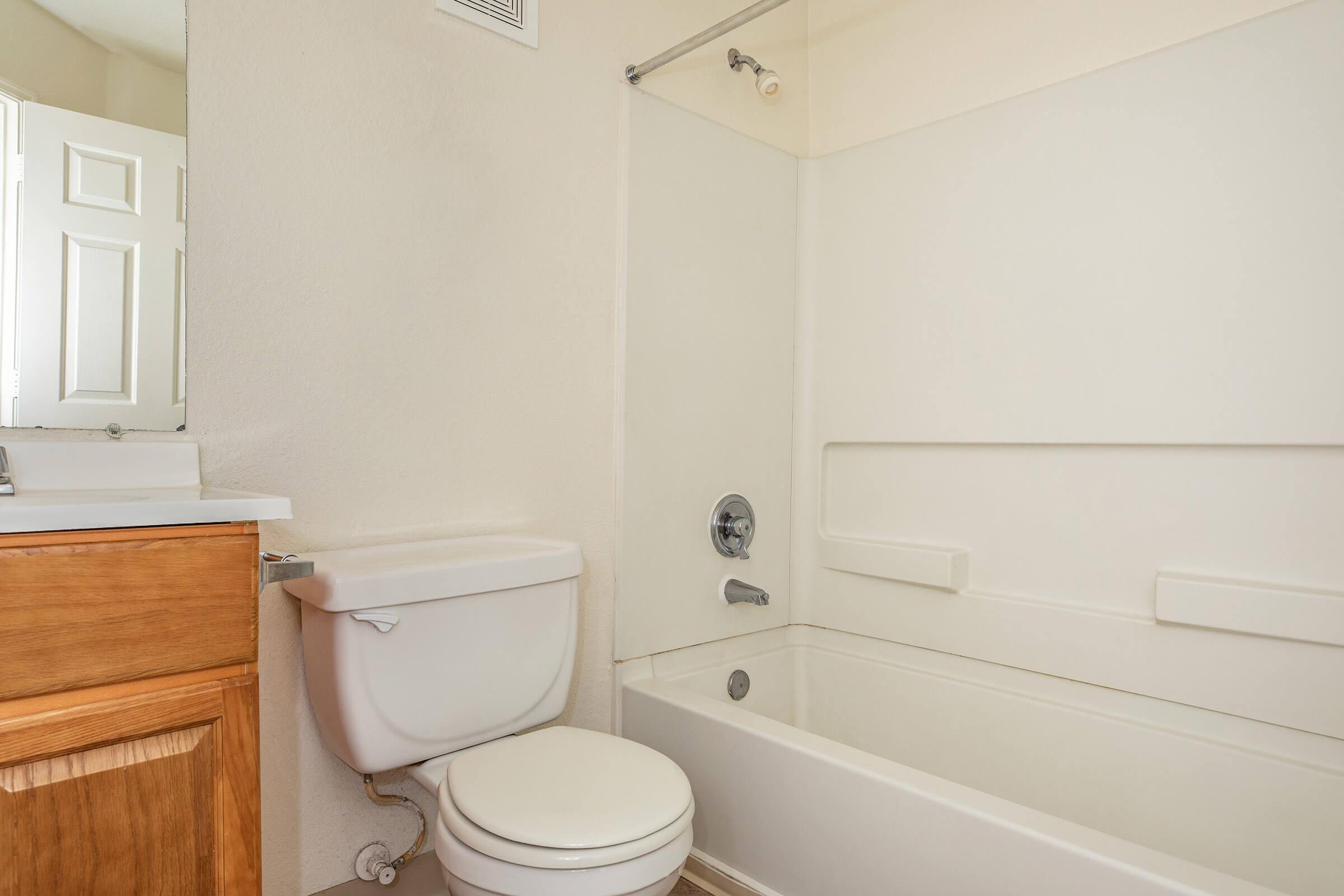 a room with a sink and a mirror