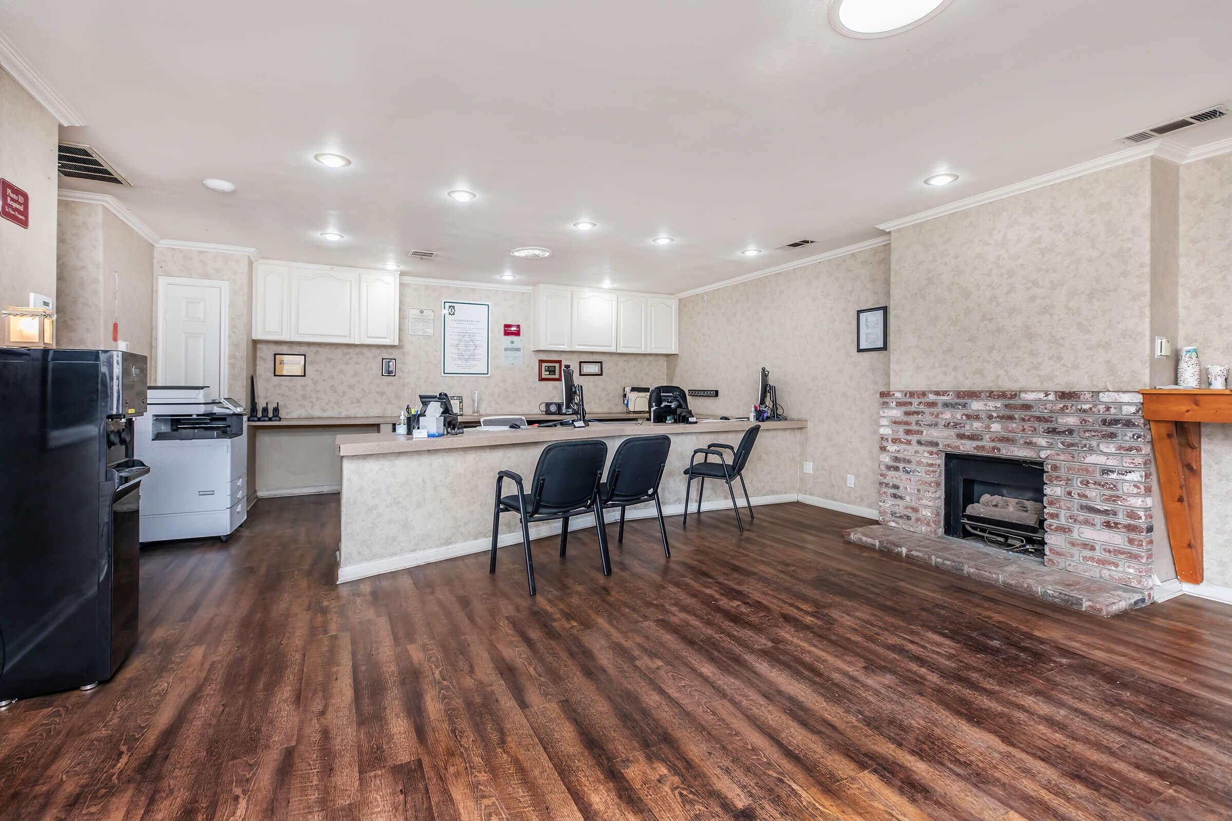 a room filled with furniture and a wood floor