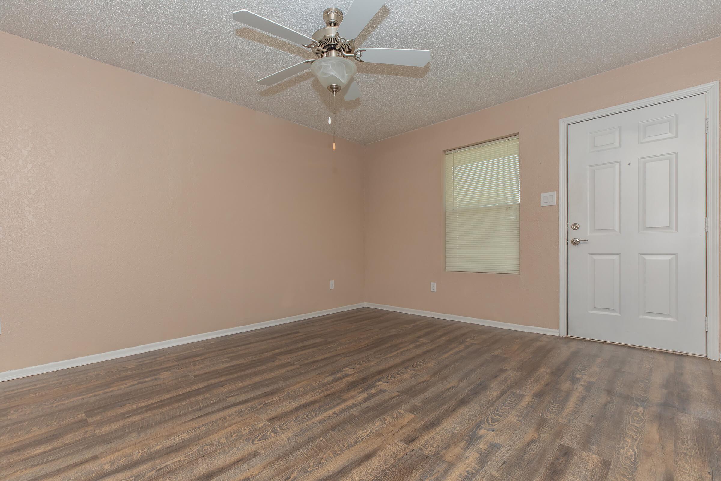 a bedroom with a bed and a mirror