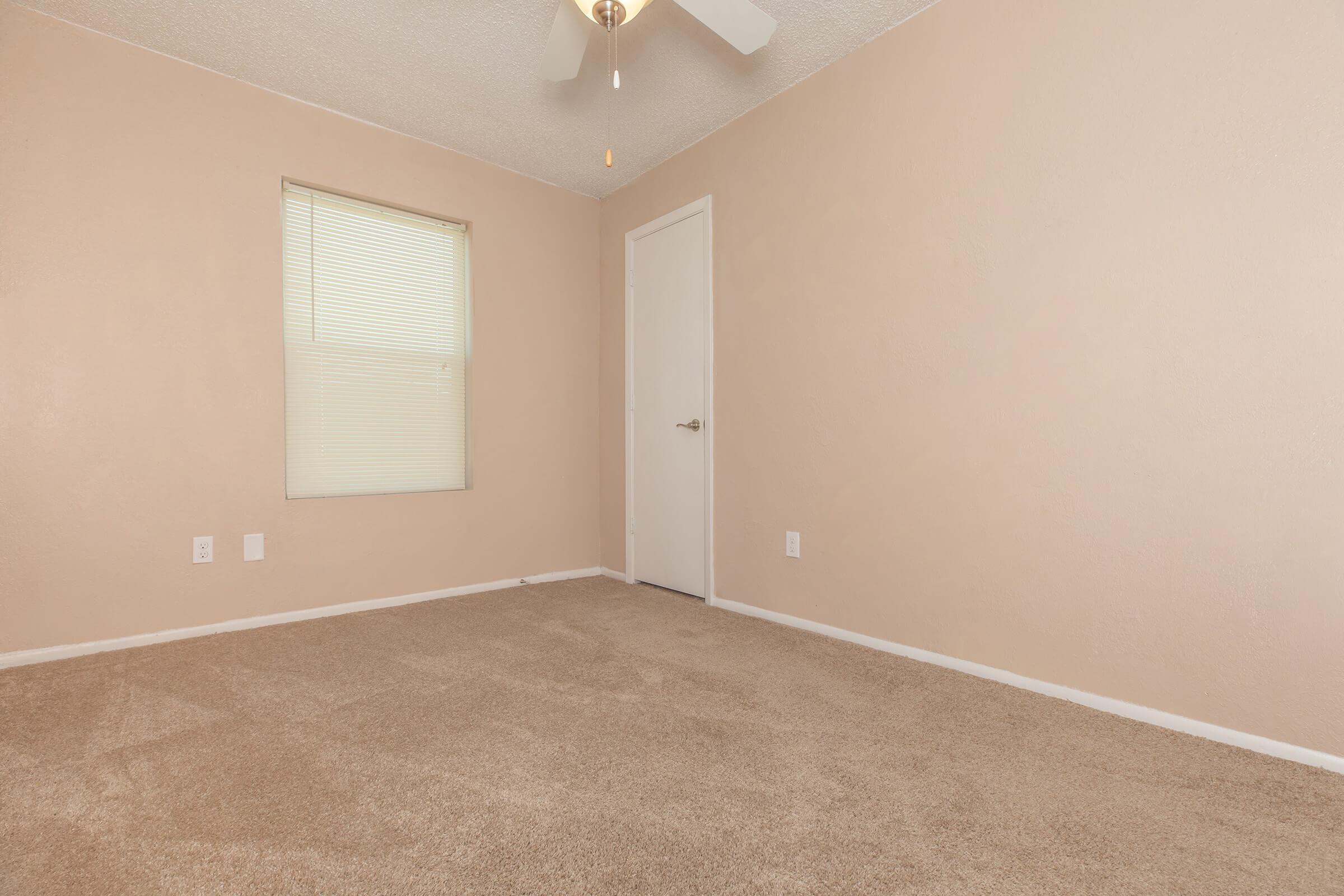 a bedroom with a large window