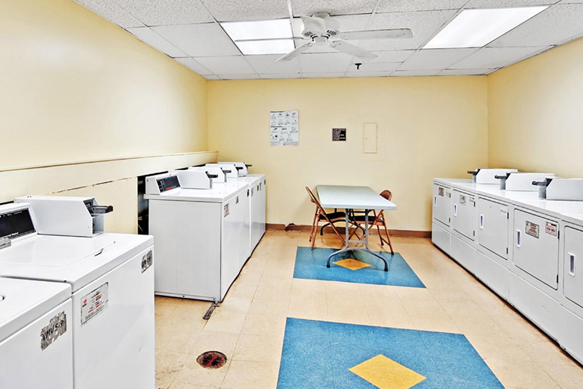 a kitchen with a stove top oven sitting inside of a room