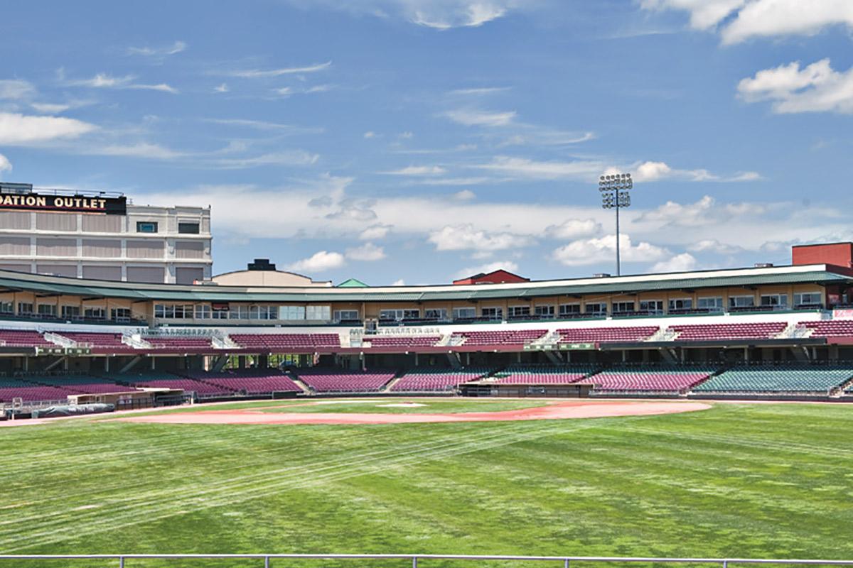 a large stadium with green grass