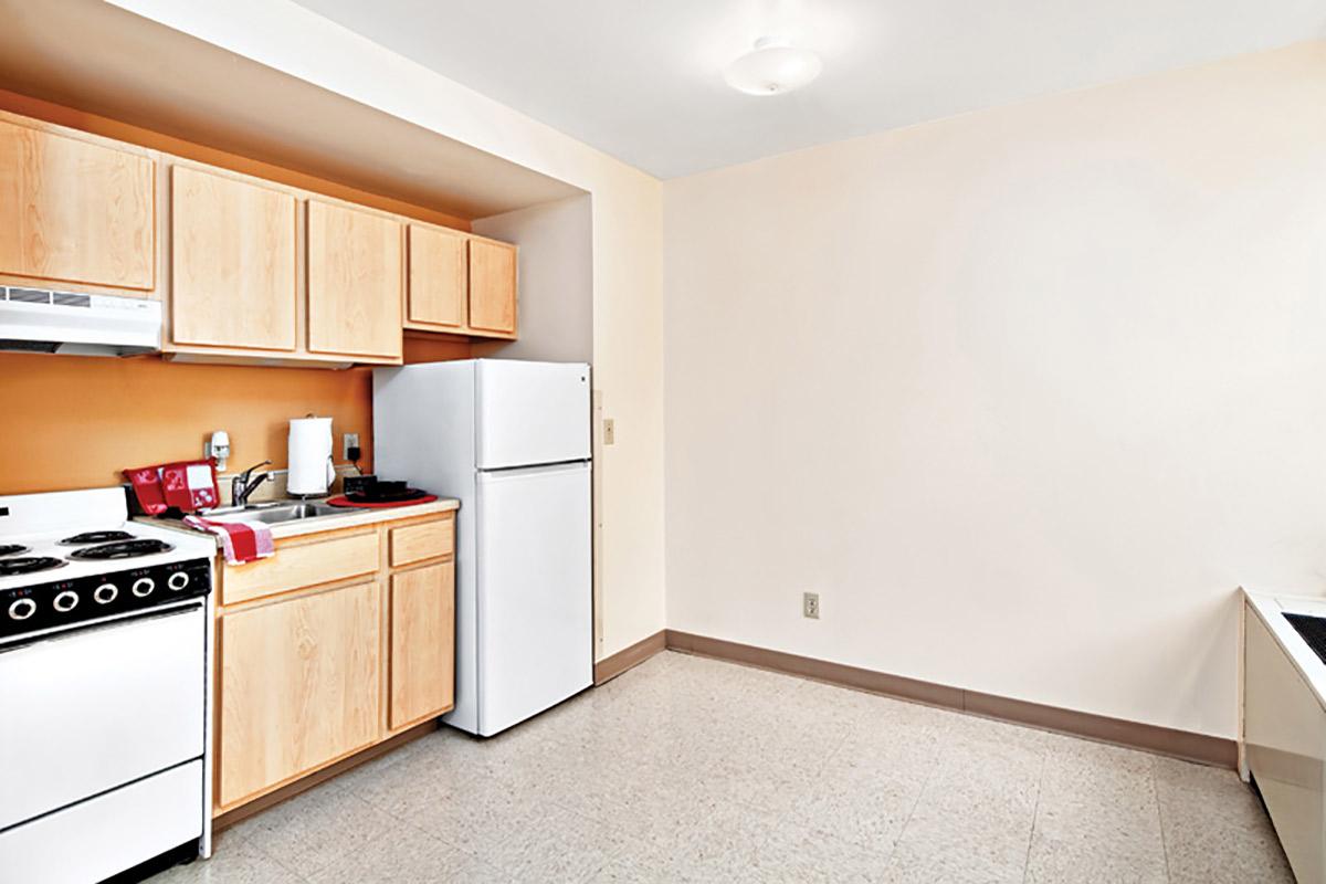 a kitchen with a stove and a refrigerator