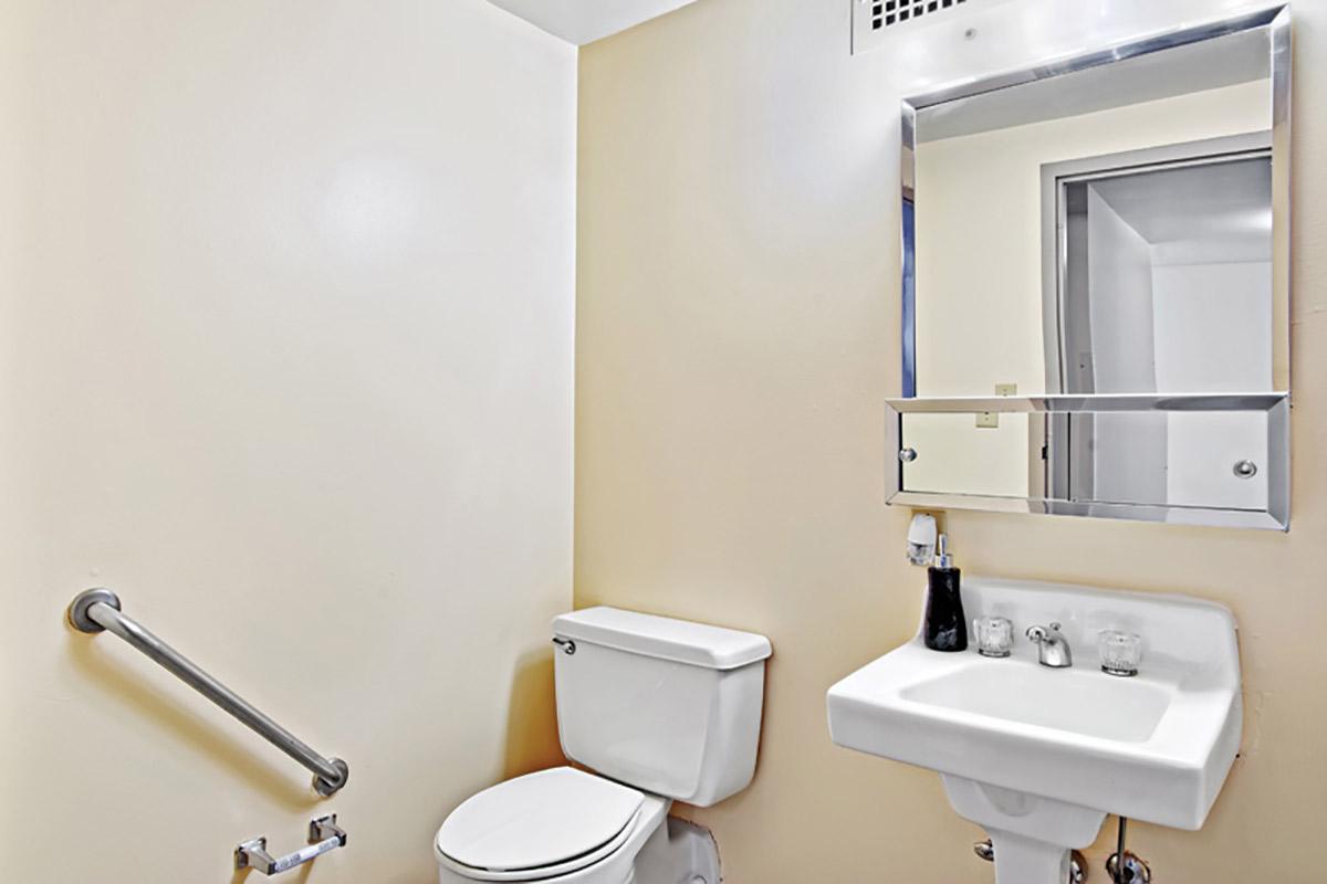 a restroom with a sink and a mirror