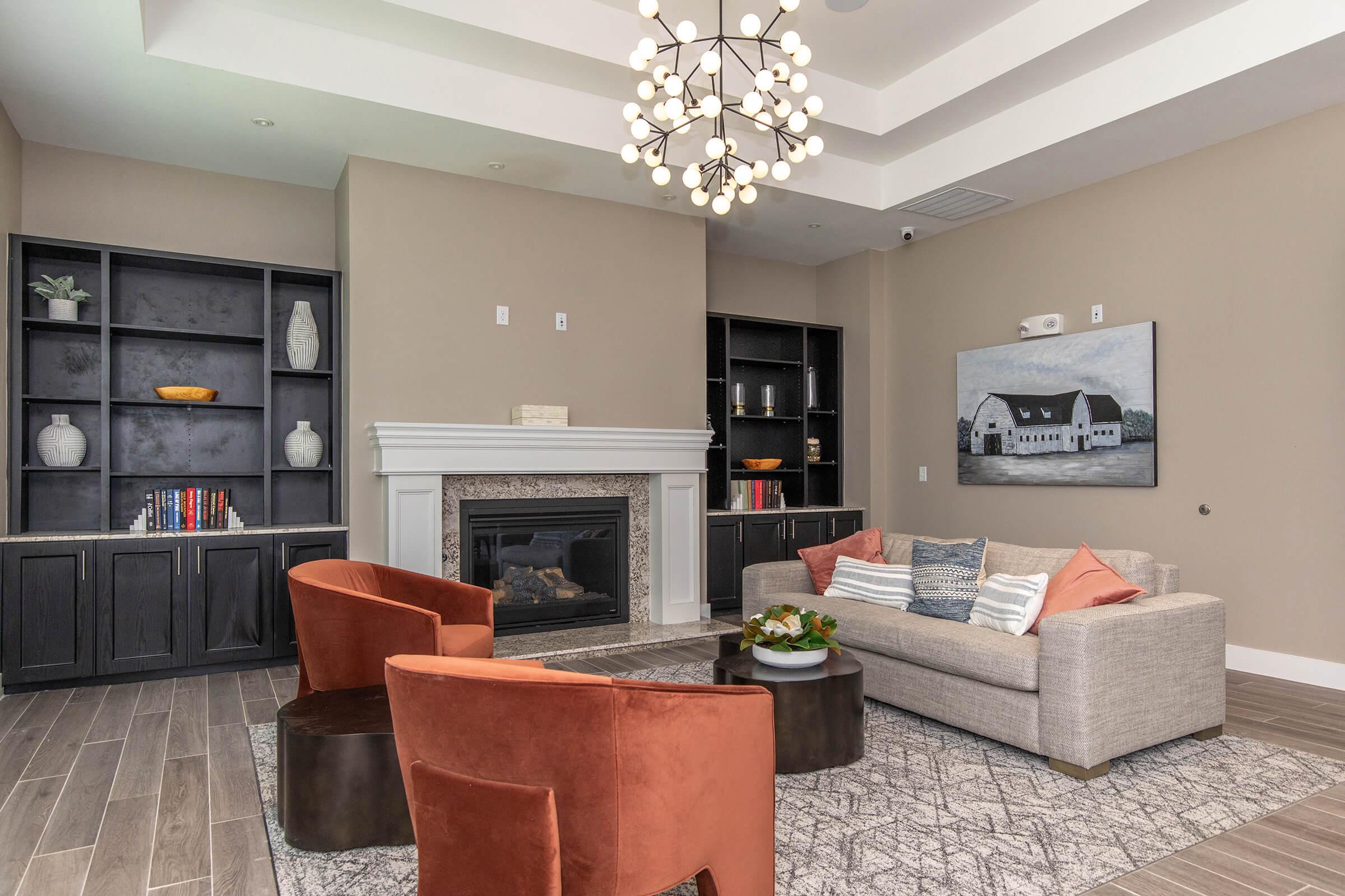 a living room filled with furniture and a fireplace