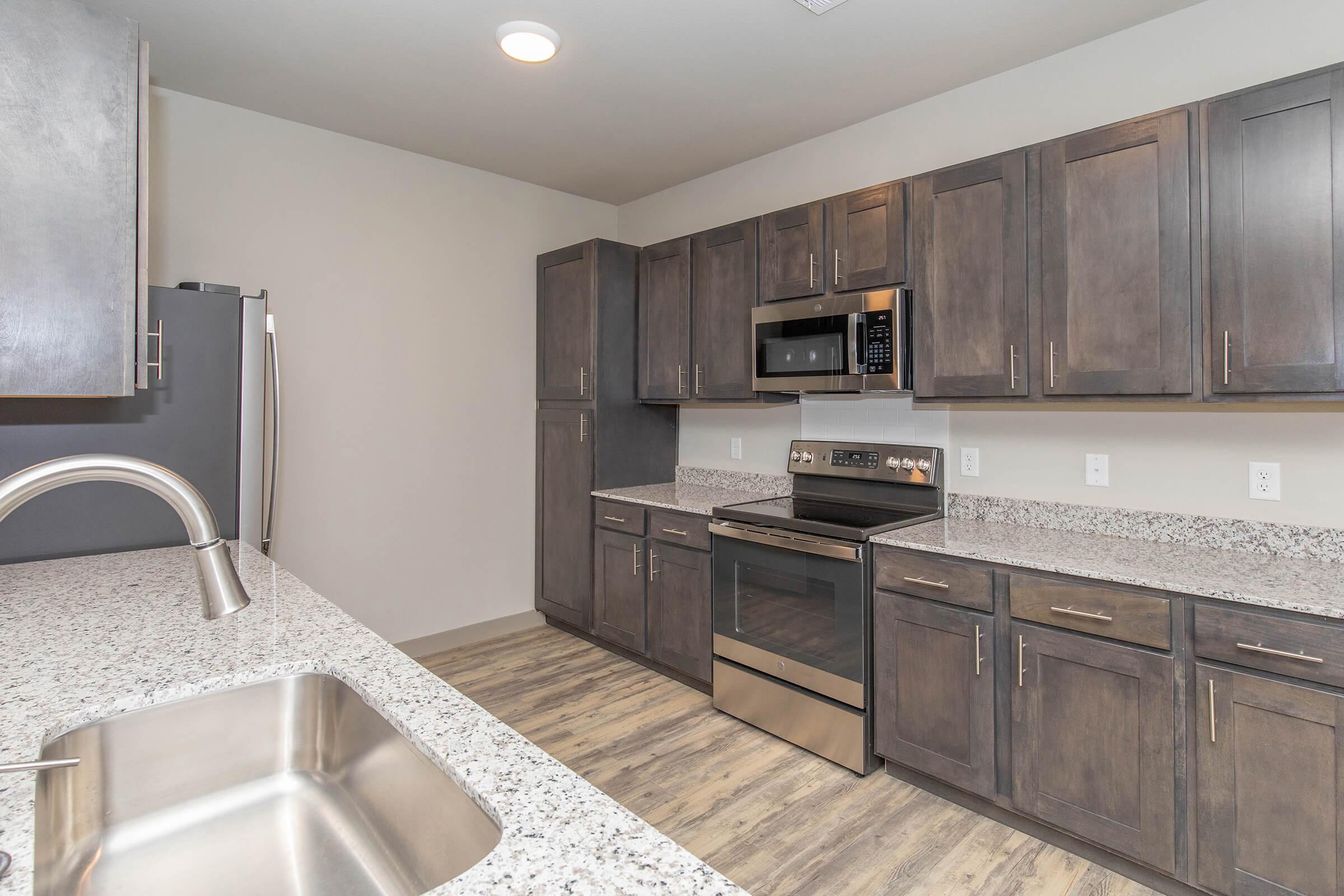 a large kitchen with stainless steel appliances