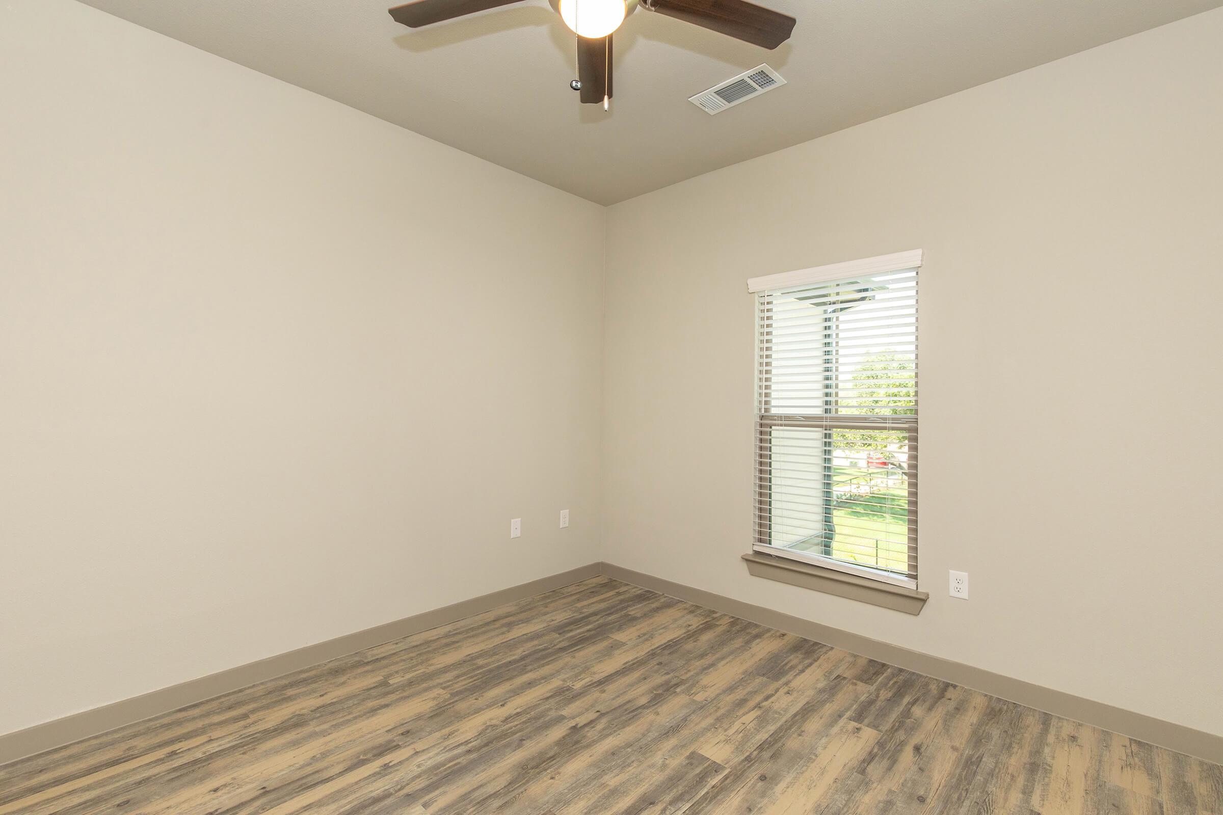 a bedroom with a large mirror