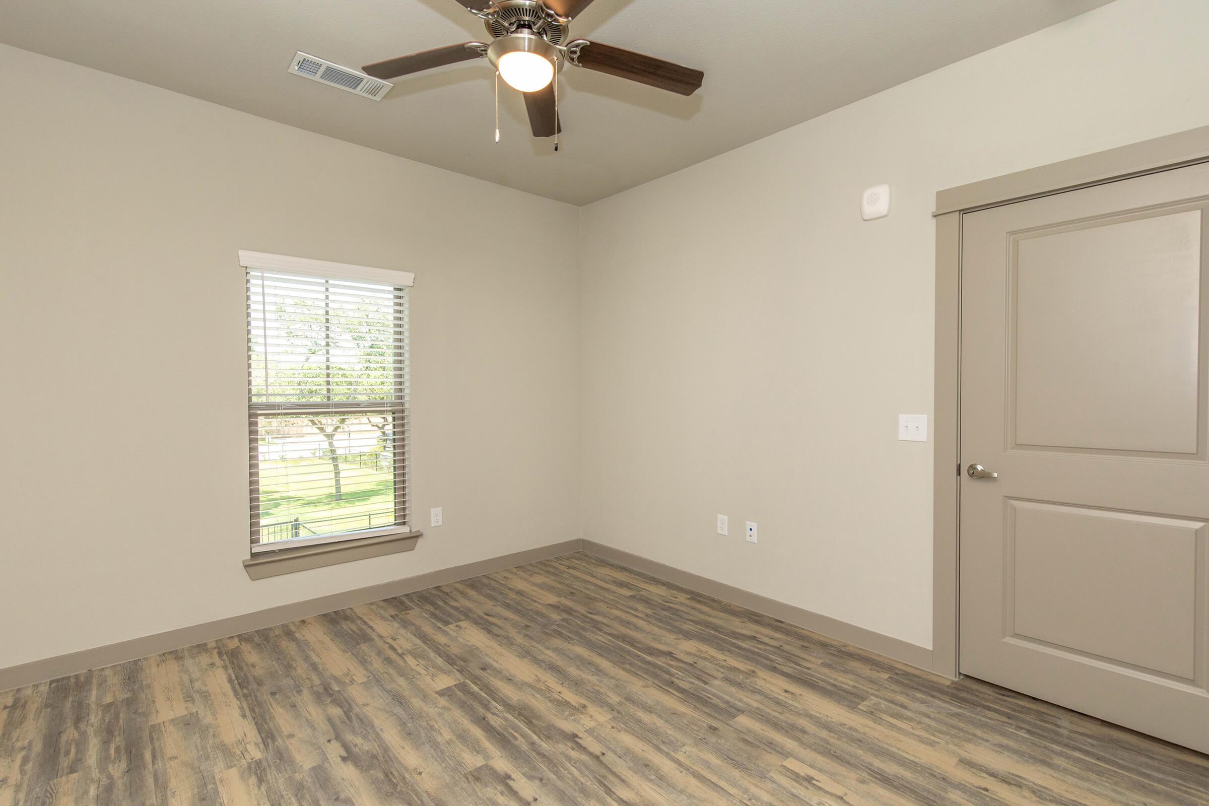 a bedroom with a large mirror