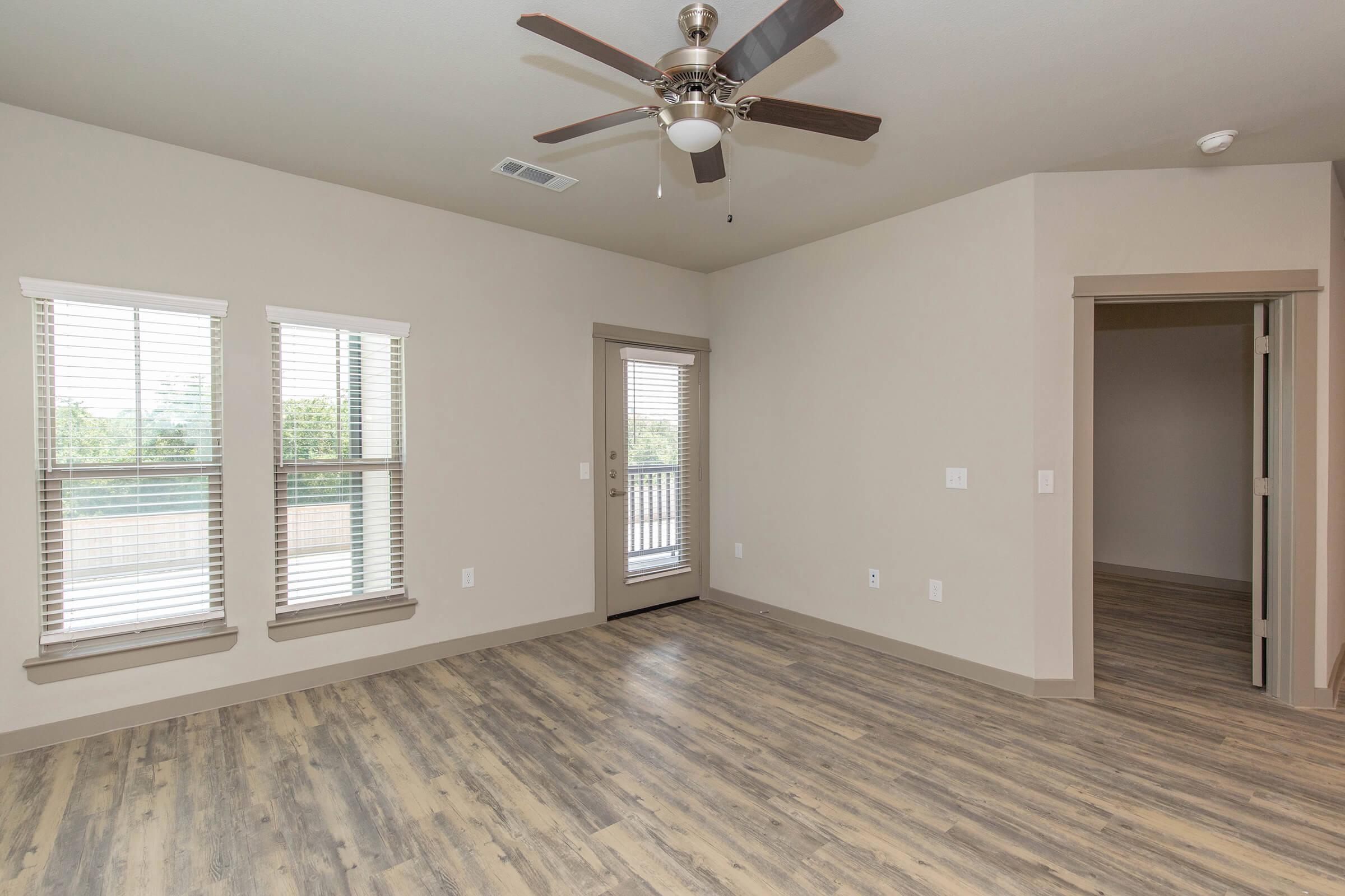 a room filled with furniture and a large window