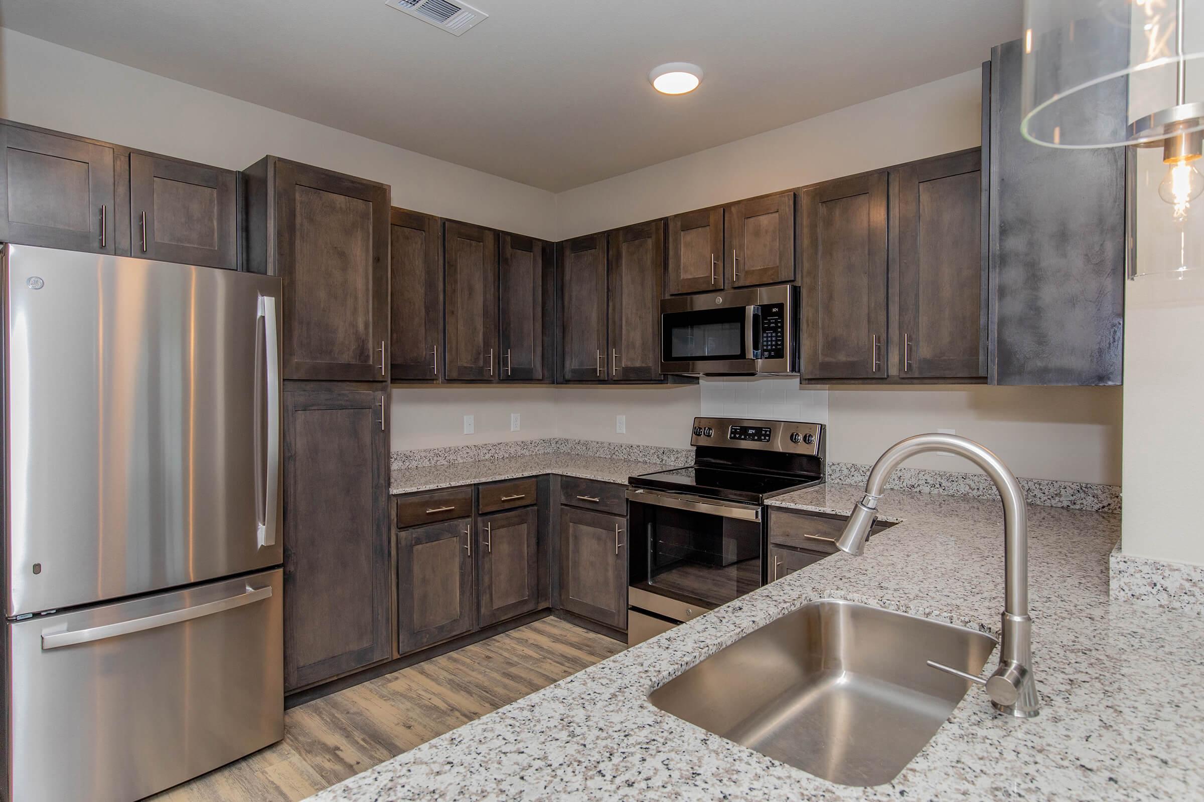 a modern kitchen with stainless steel appliances