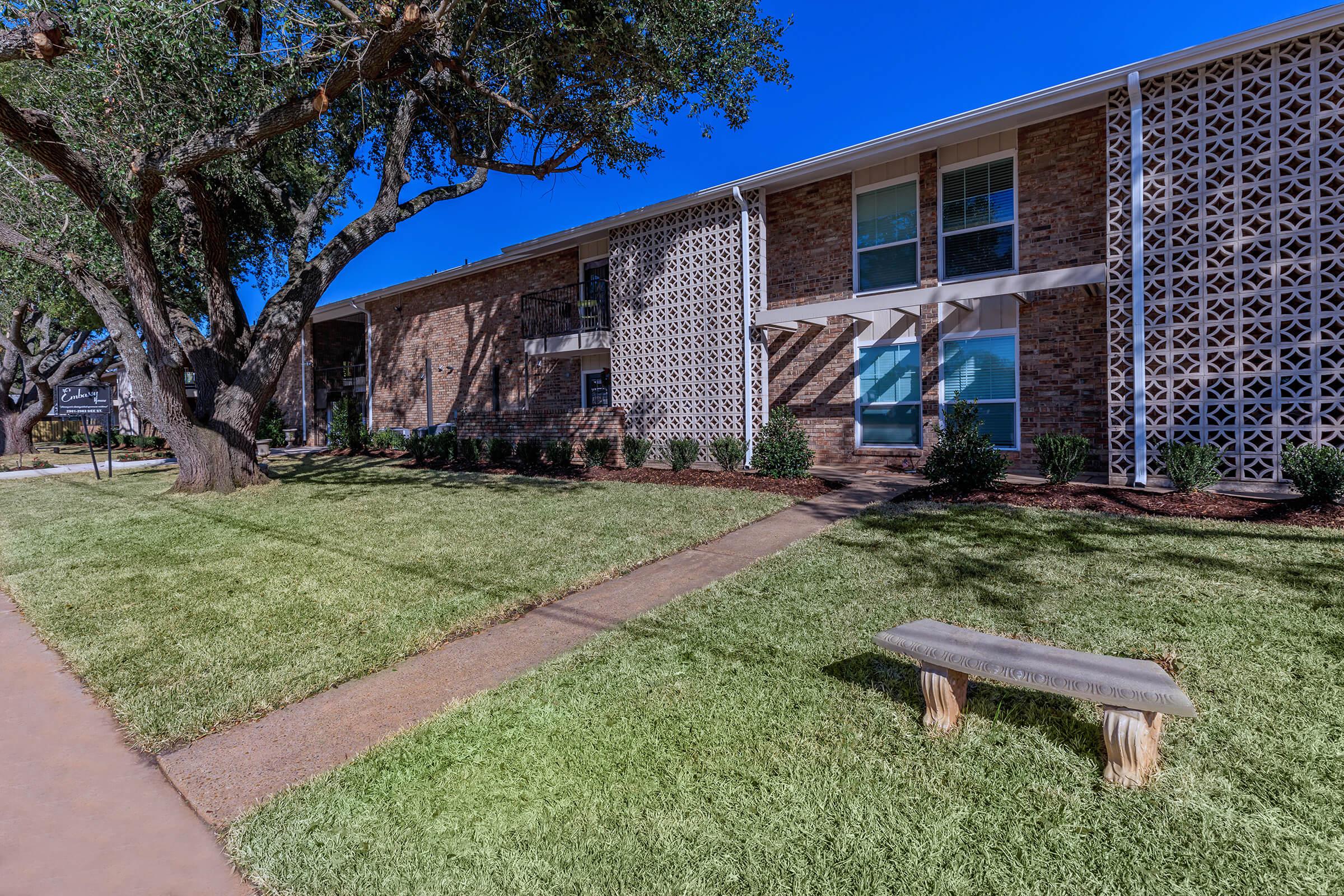 a large lawn in front of a house