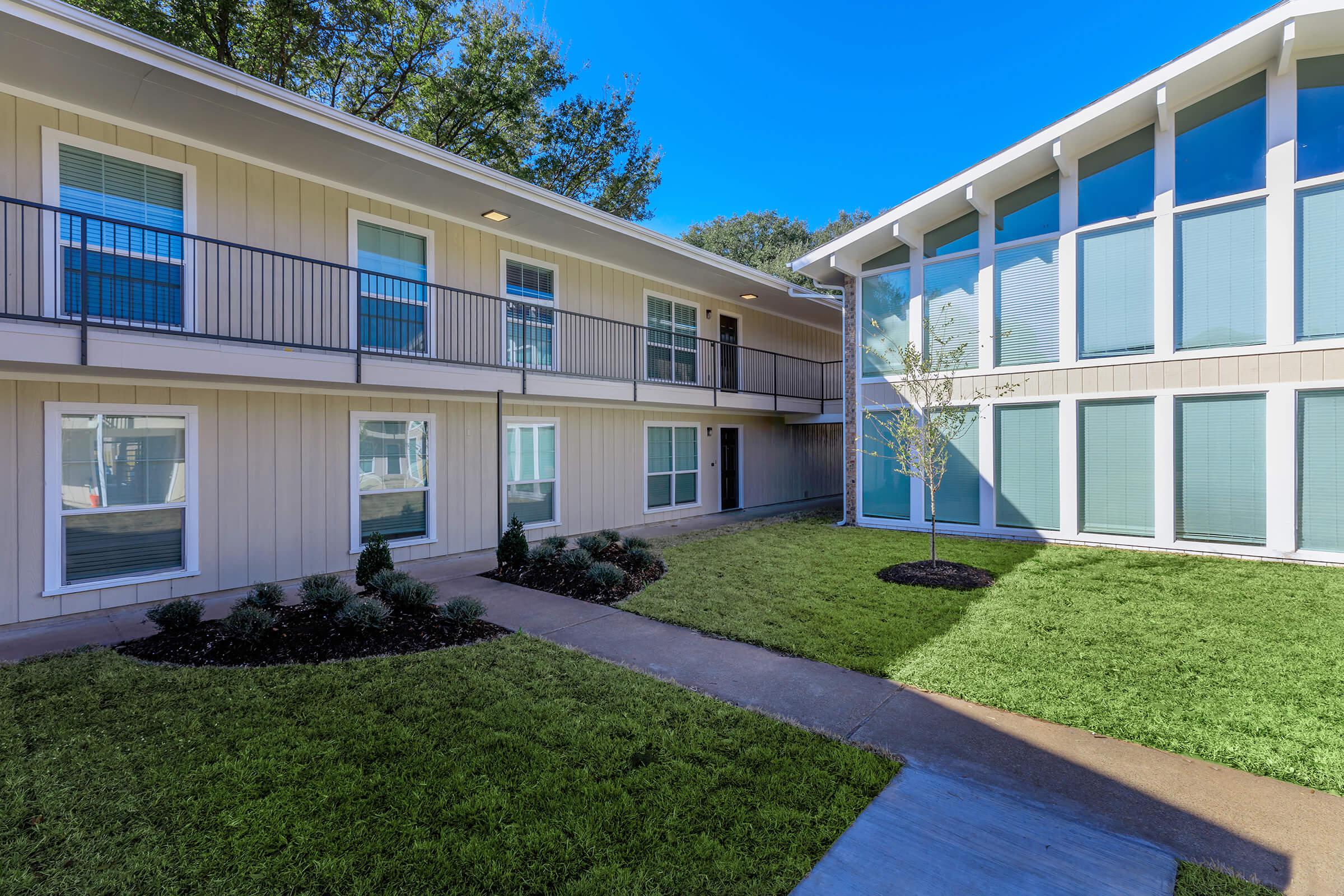 a large lawn in front of a building