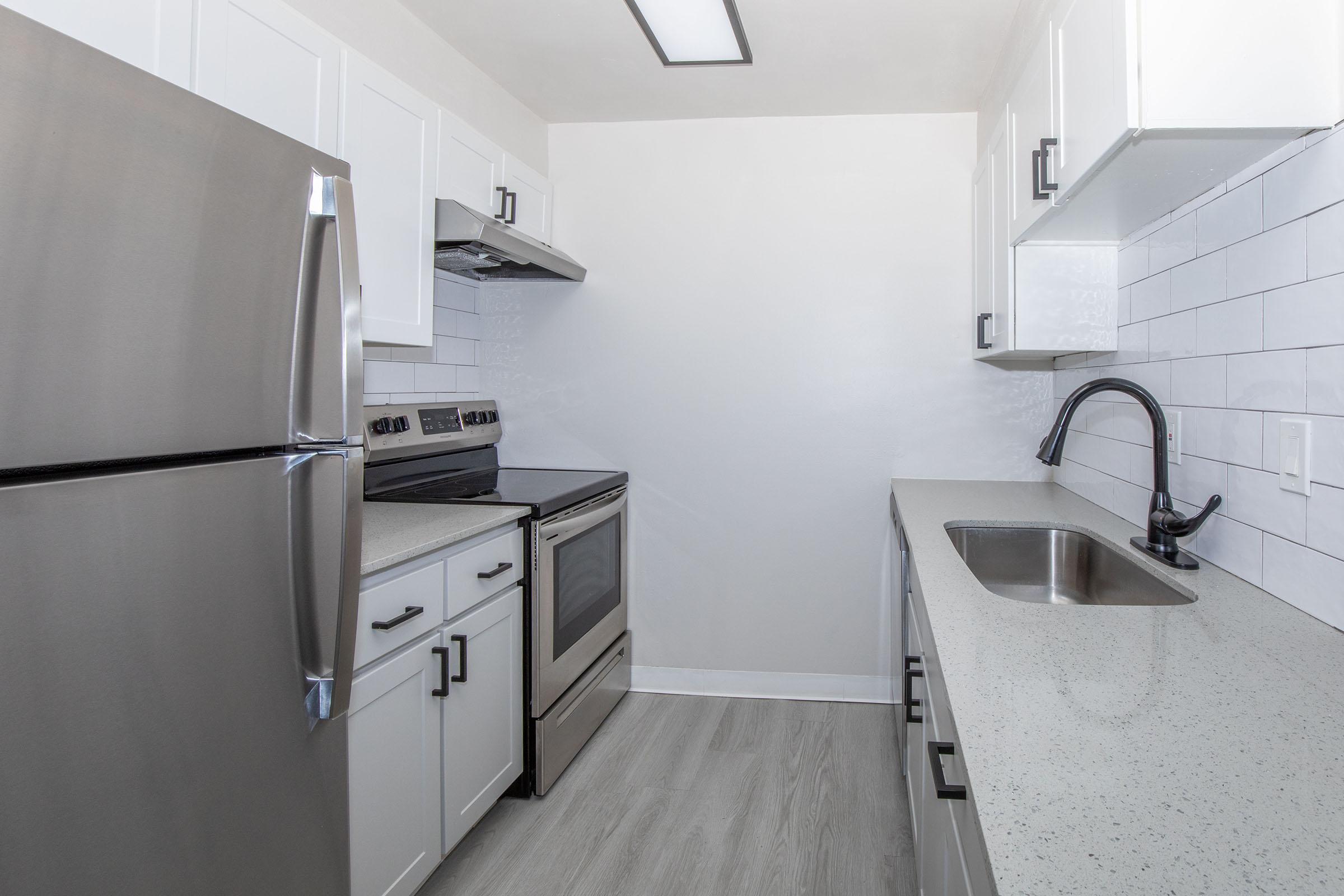 a stainless steel refrigerator in a kitchen