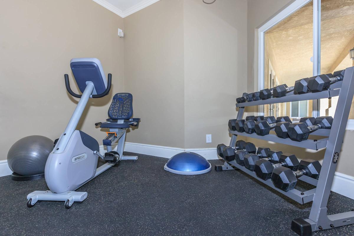 an office with a desk and chair in a room