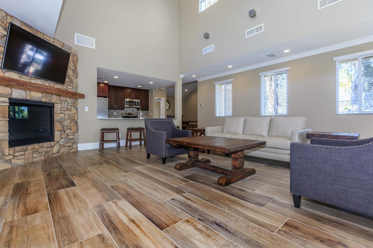 a living room filled with furniture and a fireplace