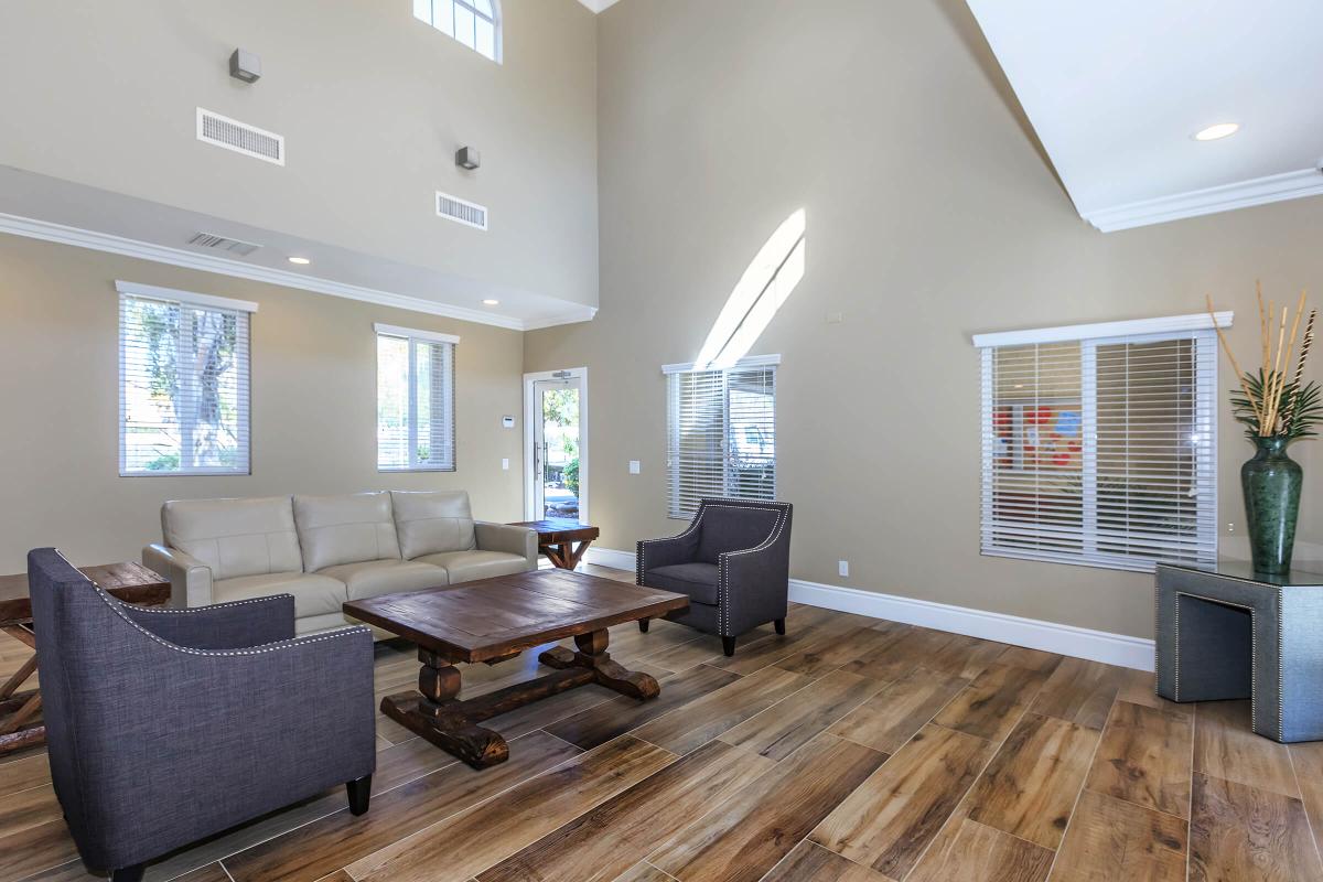 a living room filled with furniture and a flat screen tv