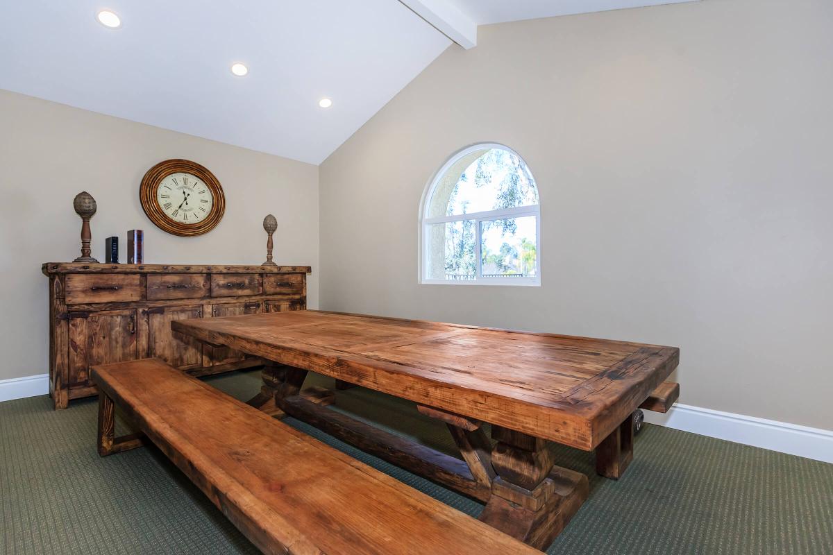 a room with a wooden table