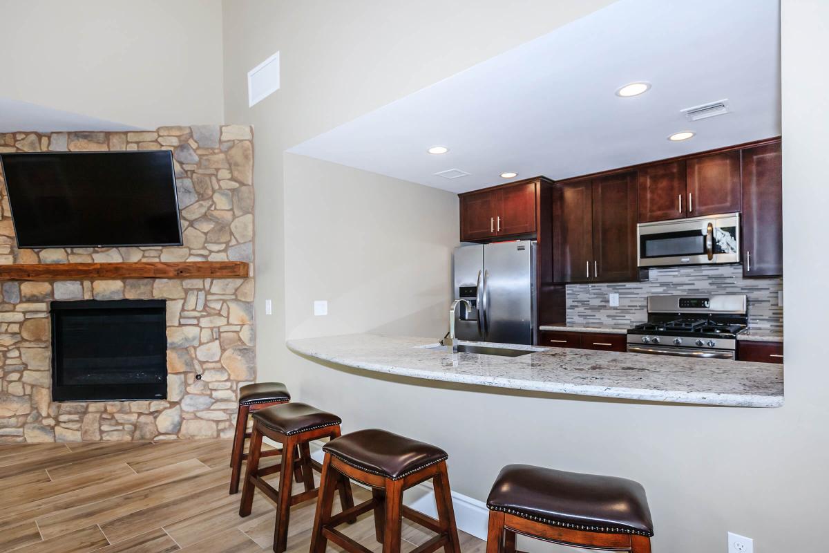 a living room filled with furniture and a fire place