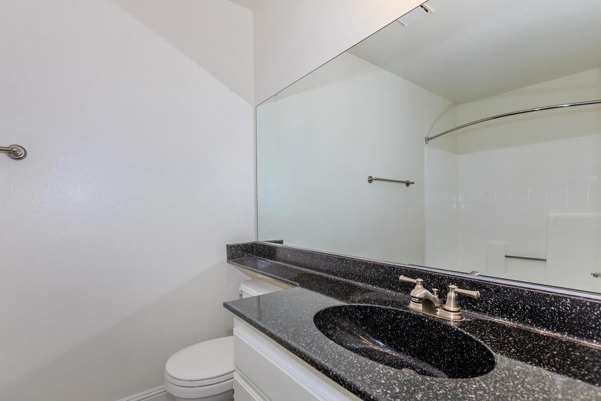 a stove top oven sitting next to a sink