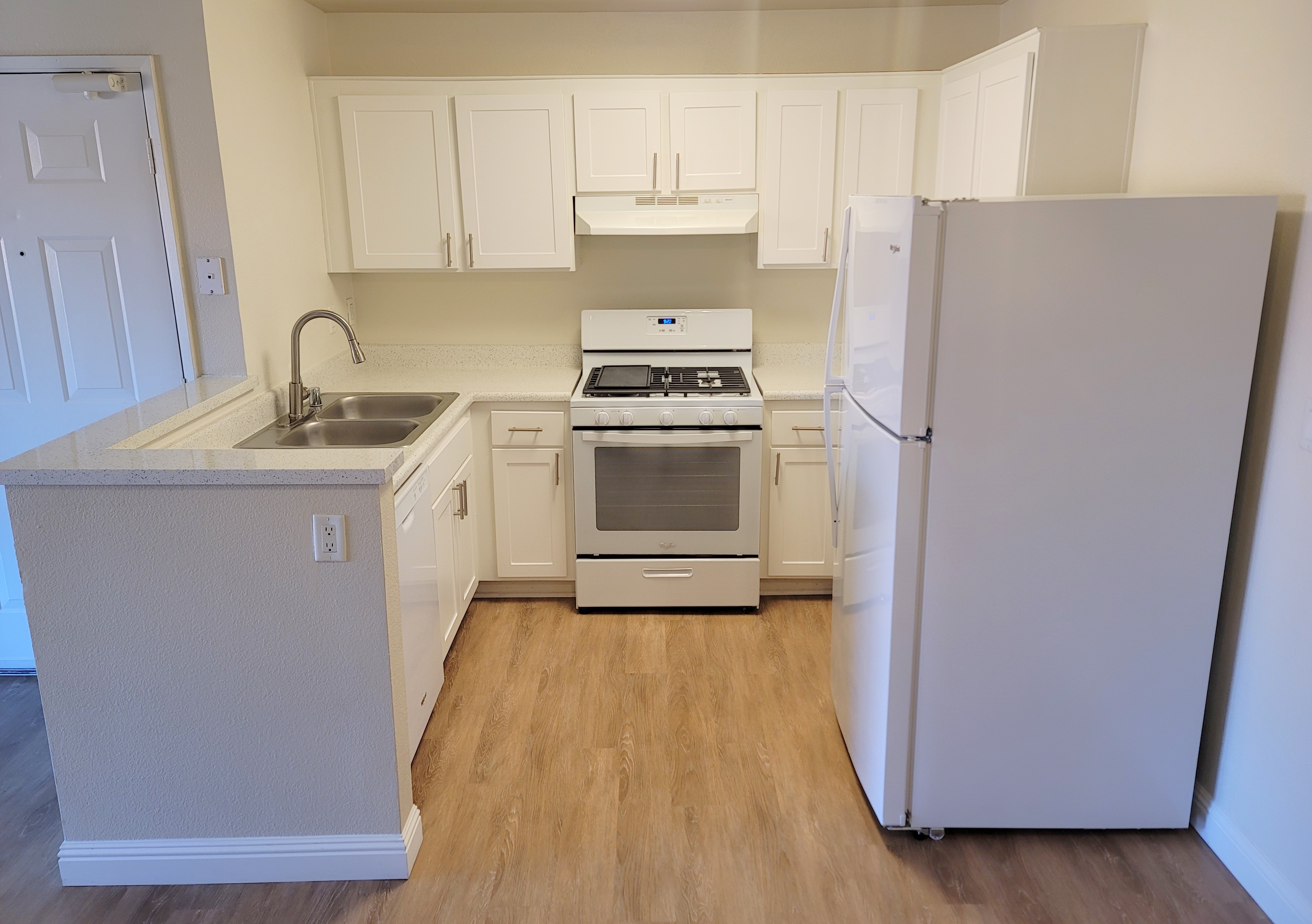 a kitchen with a stove top oven sitting inside of a refrigerator