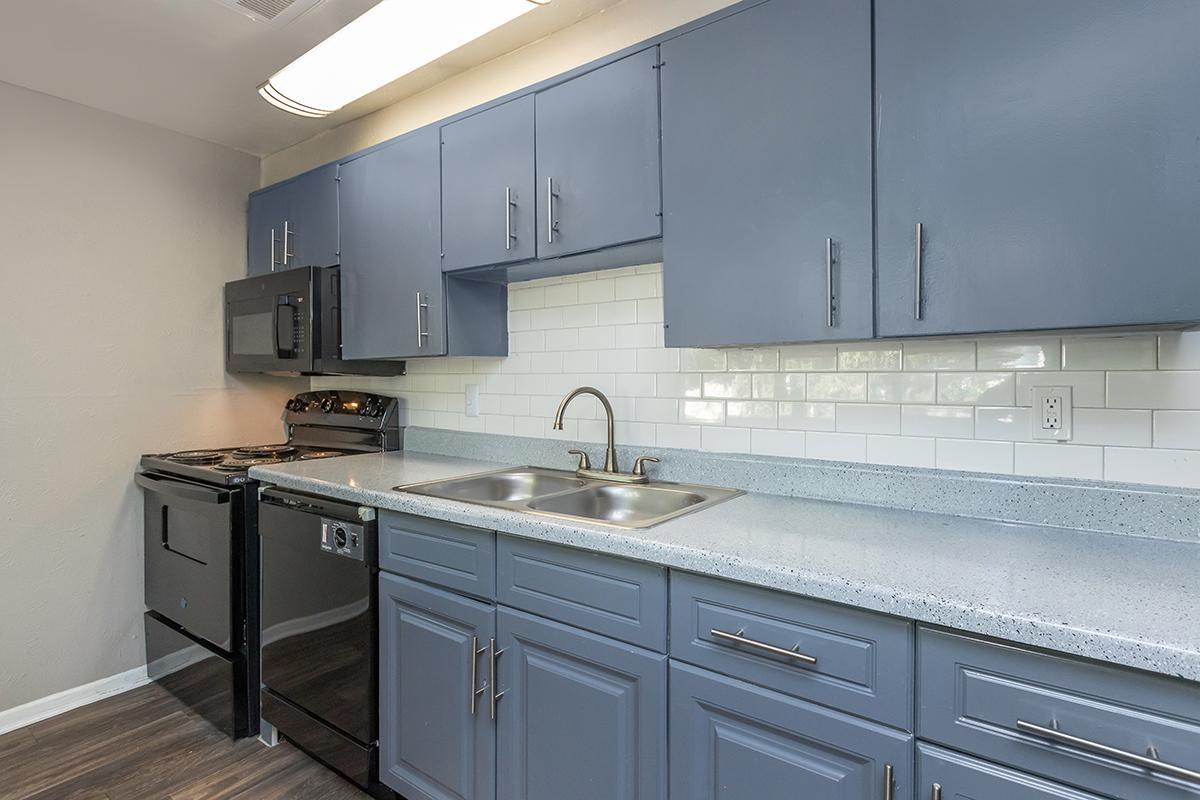 a kitchen with a stove and a sink