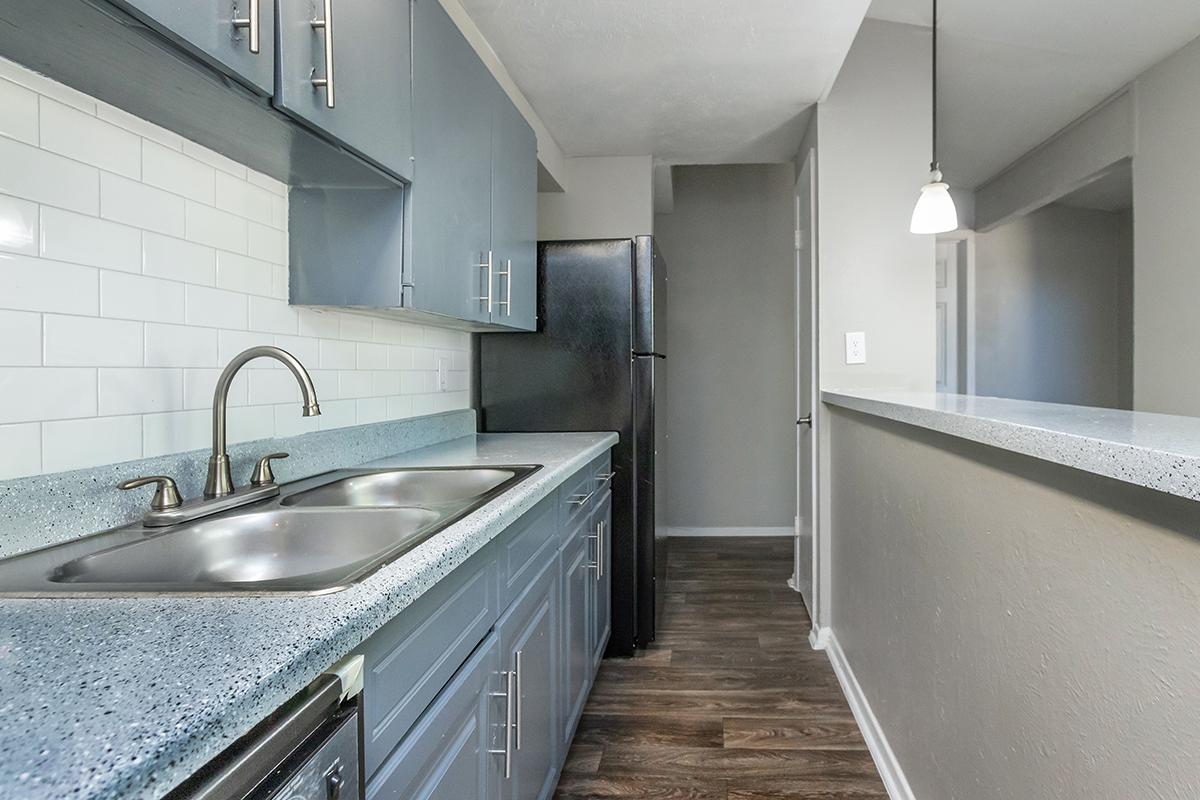 a large kitchen with stainless steel appliances