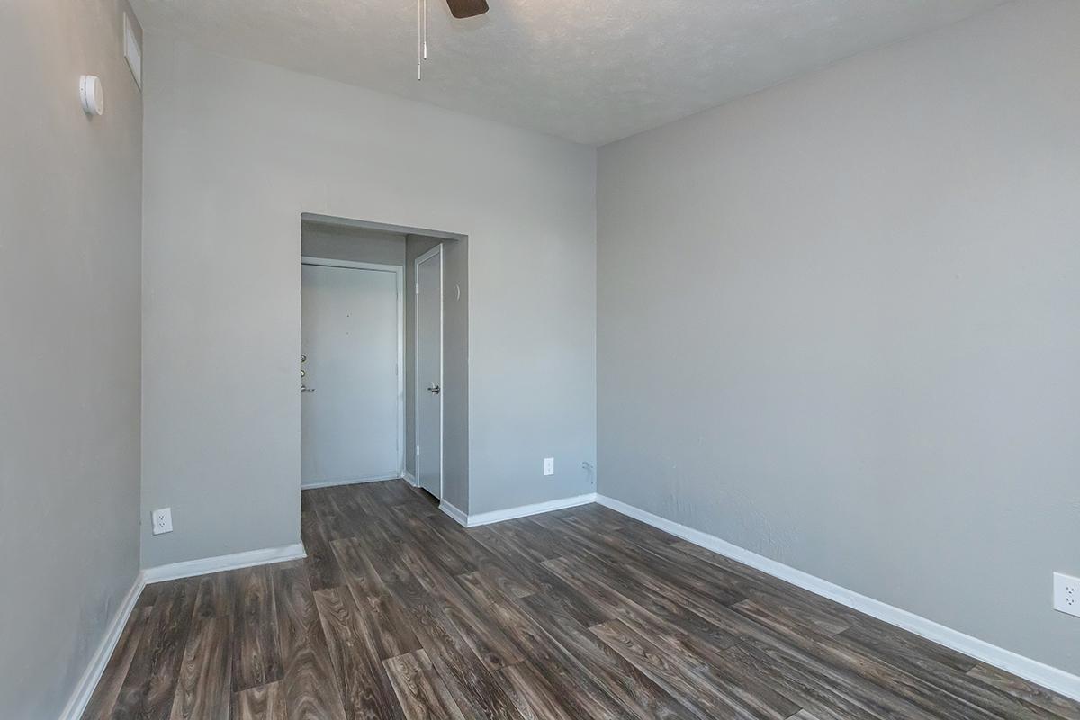 a large empty room with a wooden floor