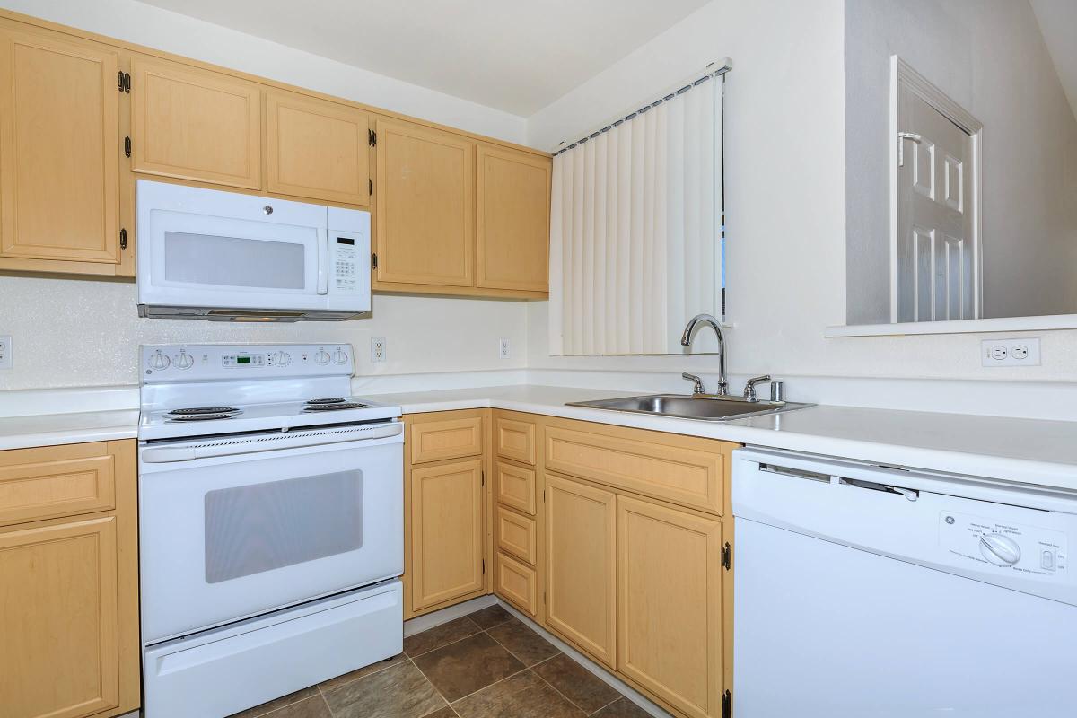 a kitchen with a stove and a microwave