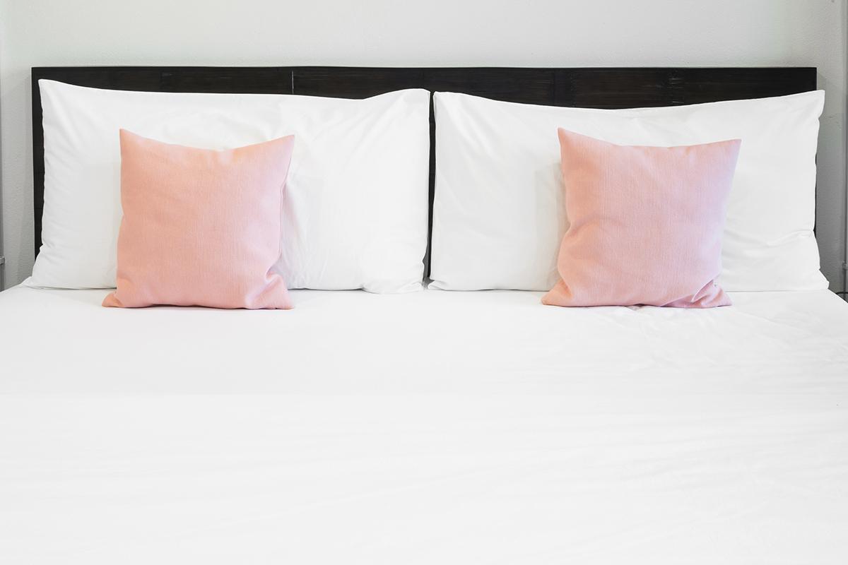Bed and pink pillows.jpg