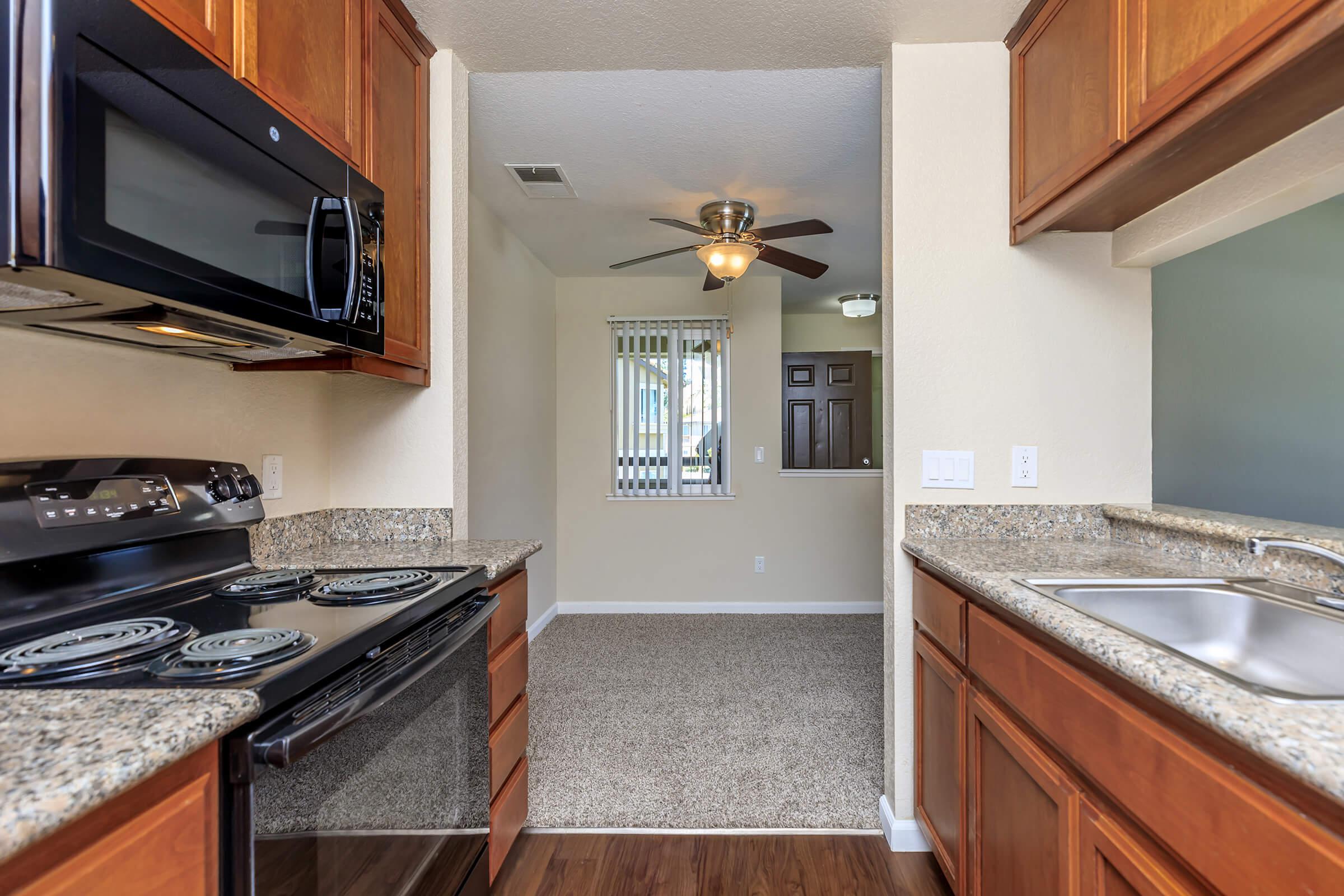 a kitchen with a stove and a sink